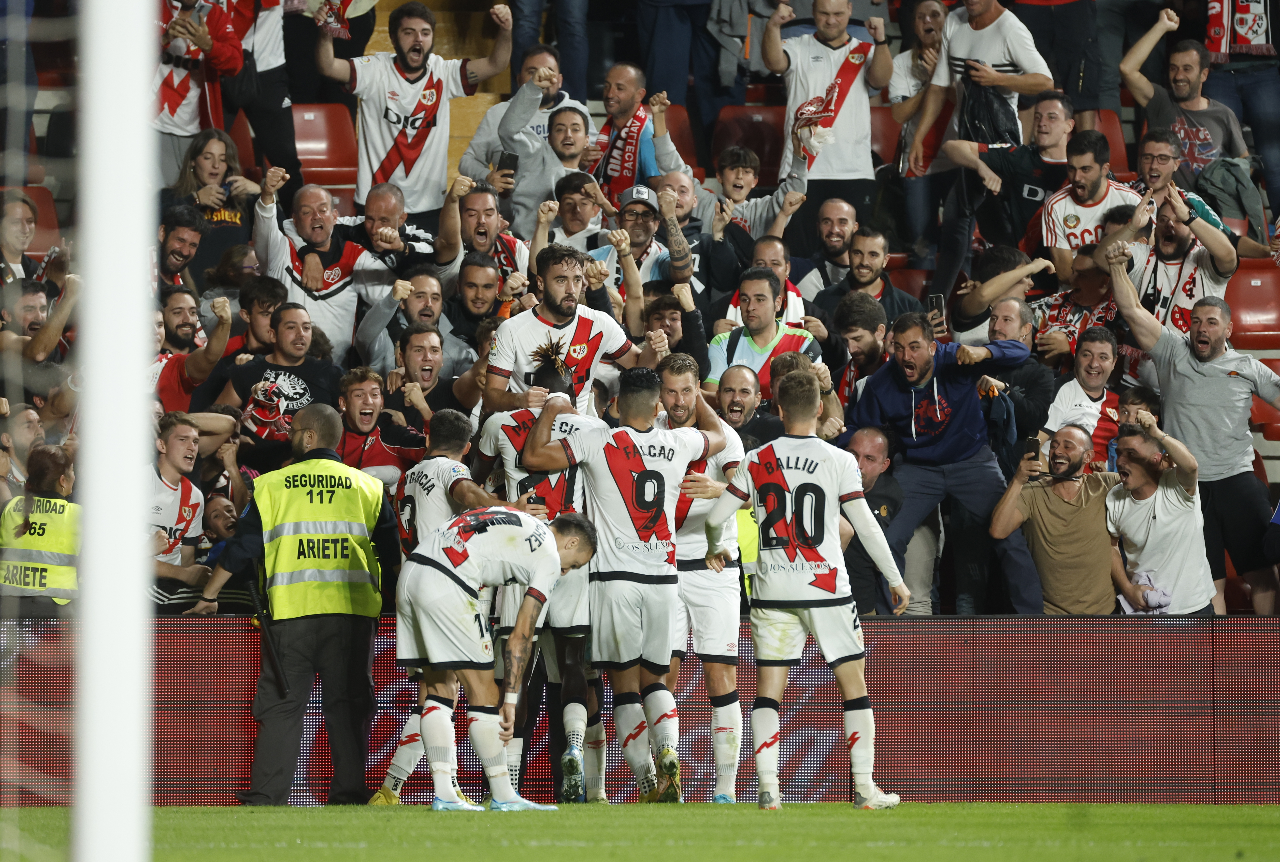 epa10221885 Rayo Vallecano players celebrate with Unai Lopez (up) at the end of the Spanish LaLiga soccer match between Rayo Vallecano and Elche CF held at Vallecas Stadium, in Madrid, Spain, 03 October 2022.  EPA-EFE/JUANJO MARTIN