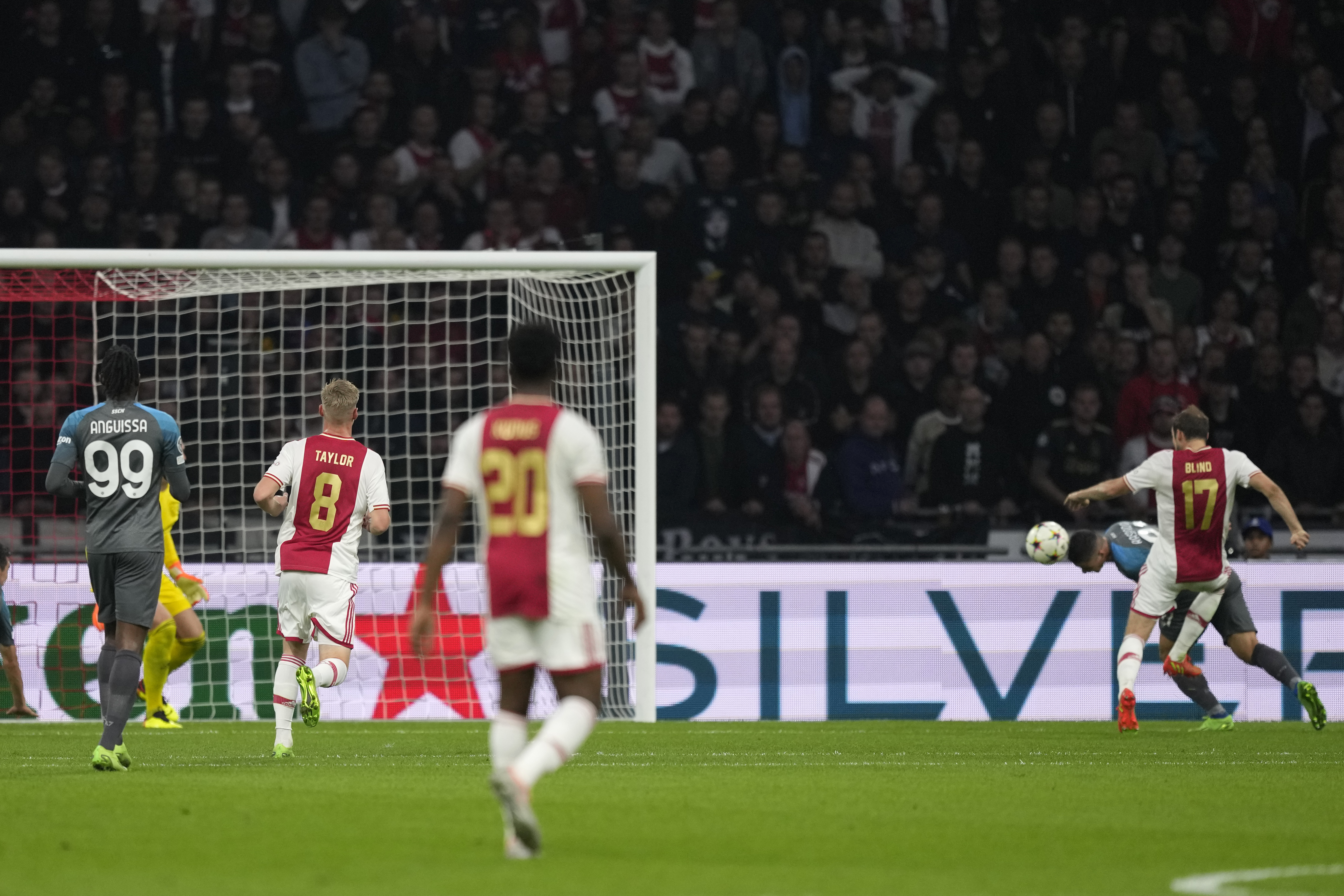 Napoli's Giacomo Raspadori, right, scores his sides first goal during the Champions League group A soccer match between Ajax and Napoli at the Johan Cruyff ArenA in Amsterdam, Netherlands, Tuesday, Oct. 4, 2022. (AP Photo/Peter Dejong)