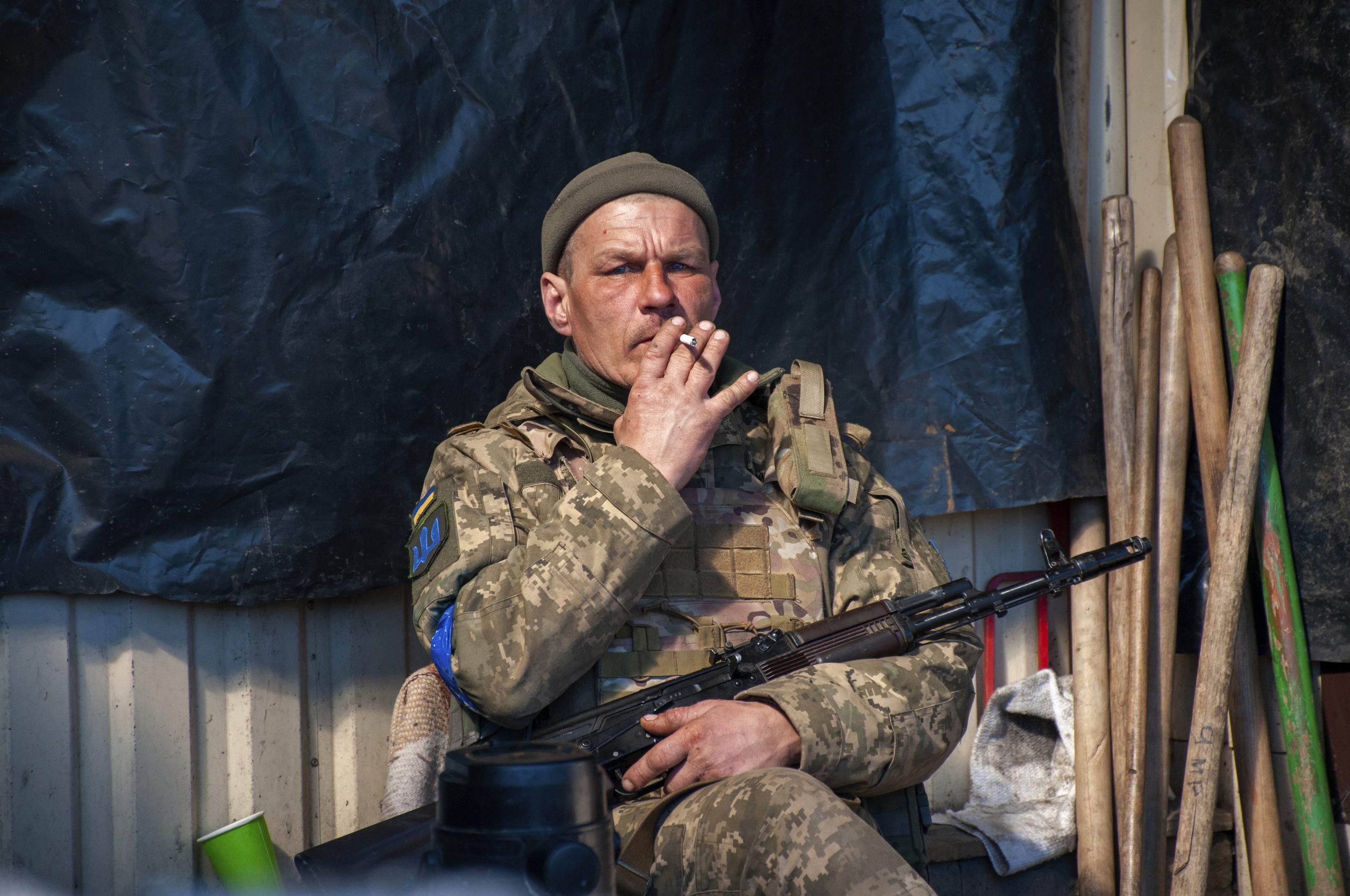A Ukrainian serviceman rests at his position in Kharkiv, Ukraine, Tuesday, March 22, 2022. (AP Photo/Andrew Marienko)