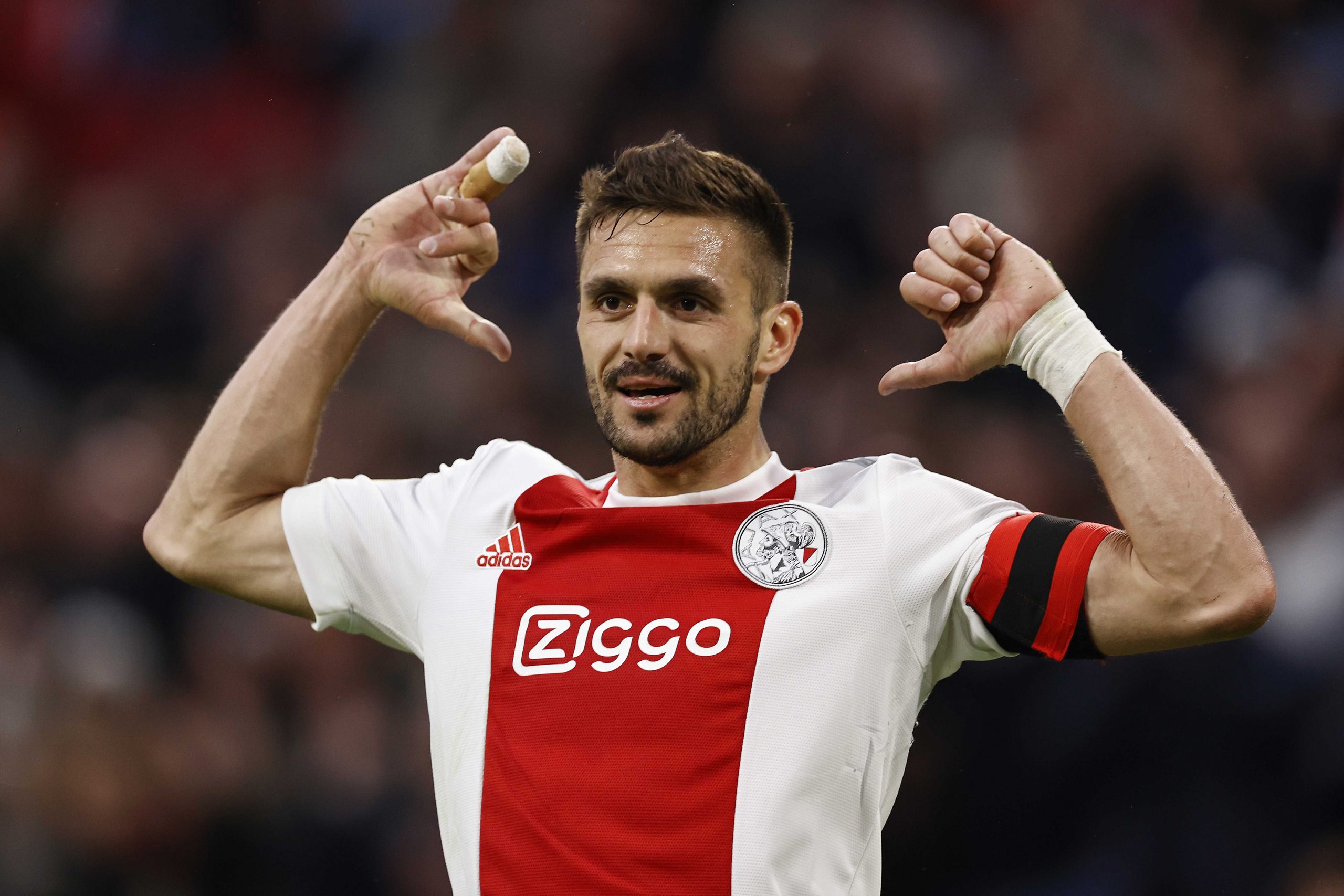epa09919053 Dusan Tadic of Ajax celebrates scoring the 1-0 goal during the Dutch Eredivisie soccer match between Ajax Amsterdam and PEC Zwolle at the Johan Cruijff ArenA in Amsterdam, Netherlands, 30 April 2022.  EPA-EFE/MAURICE VAN STEEN