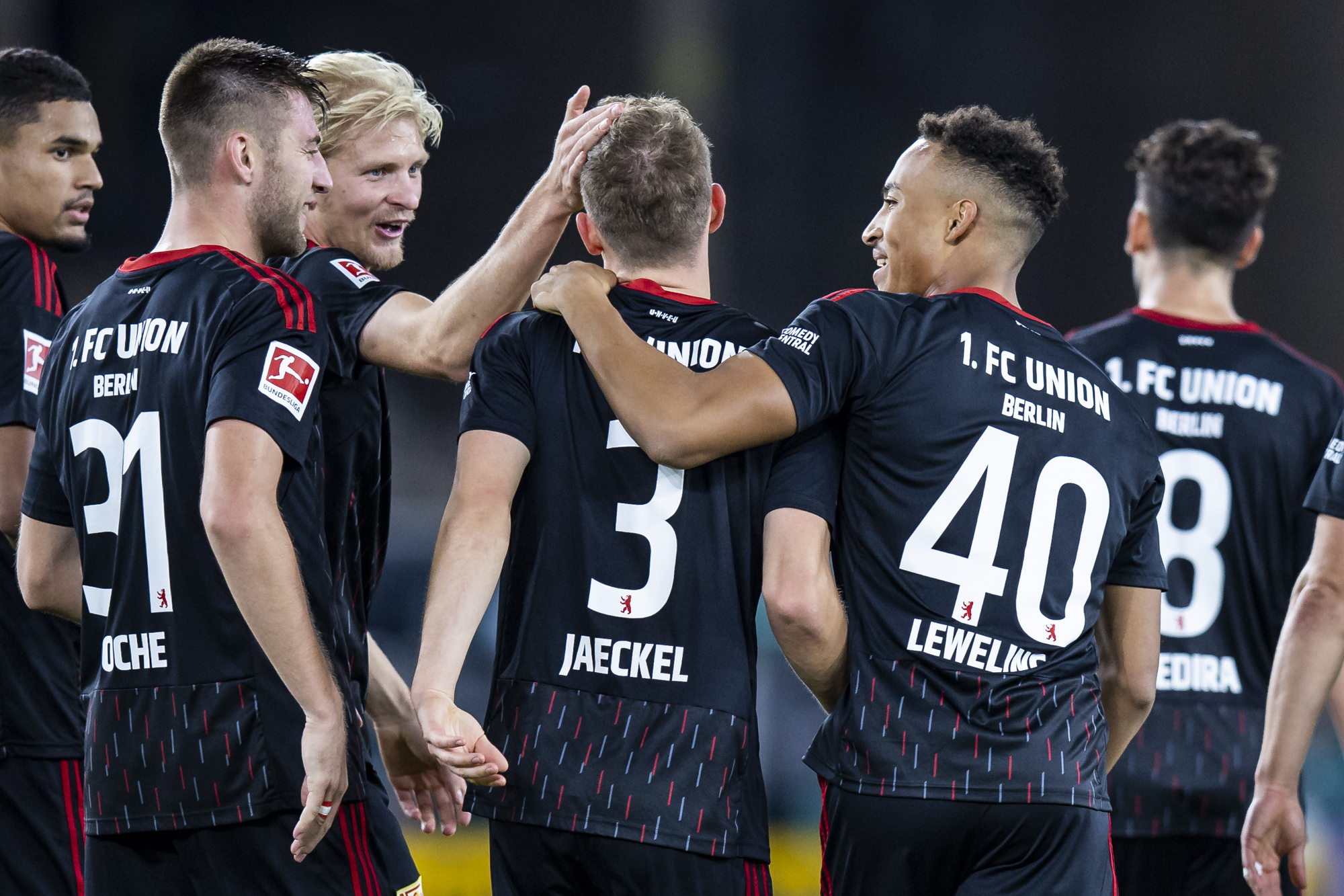 Union Berlin's Paul Jaeckel, center, celebrates scoring with teammates during the Bundesliga soccer match between VfB Stuttgart and FC Union Berlin, Mercedes-Benz Arena in Stuttgart, Germany, Sunday Oct. 9, 2022. (Tom Weller/dpa via AP)