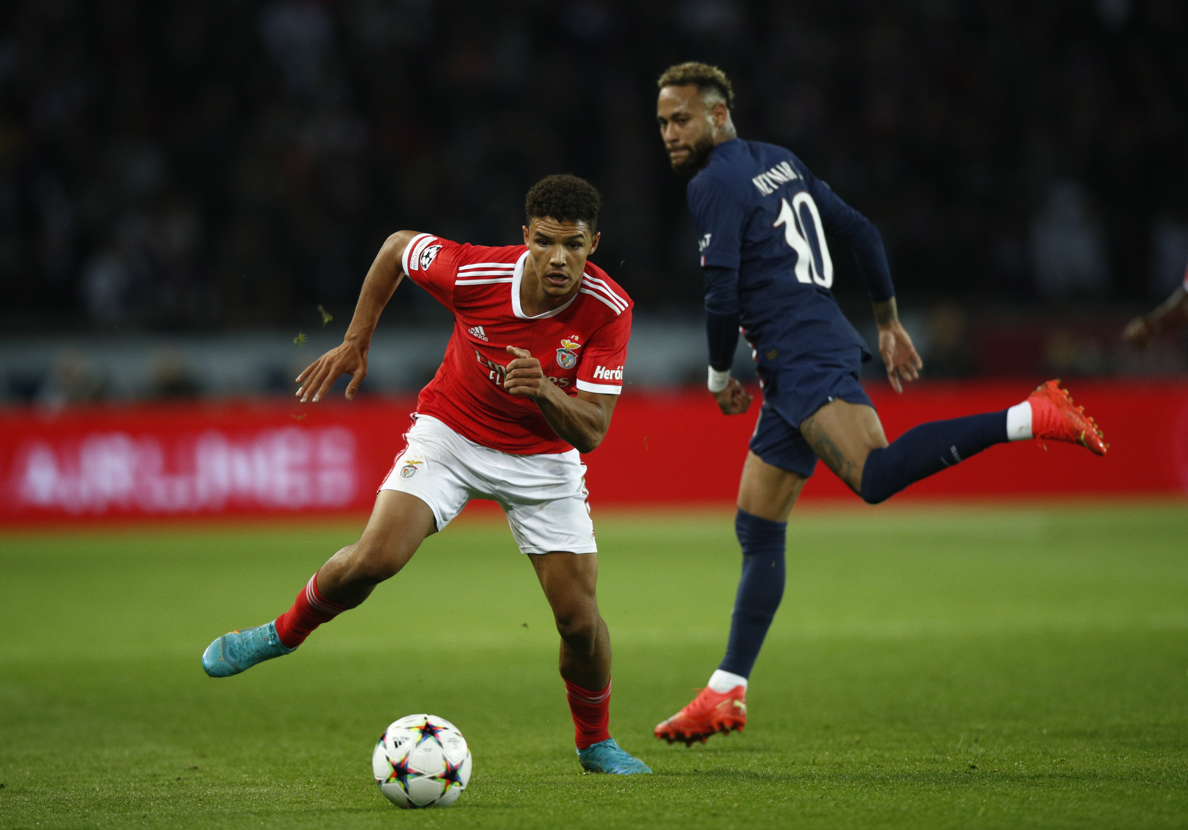 epa10237045 Paris Saint Germain's Neymar Jr (R) in action against Benfica's Alexander Bah (L) during the UEFA Champions League group H soccer match between Paris Saint-Germain (PSG) and SL Benfica in Paris, France, 11 October 2022.  EPA-EFE/YOAN VALAT