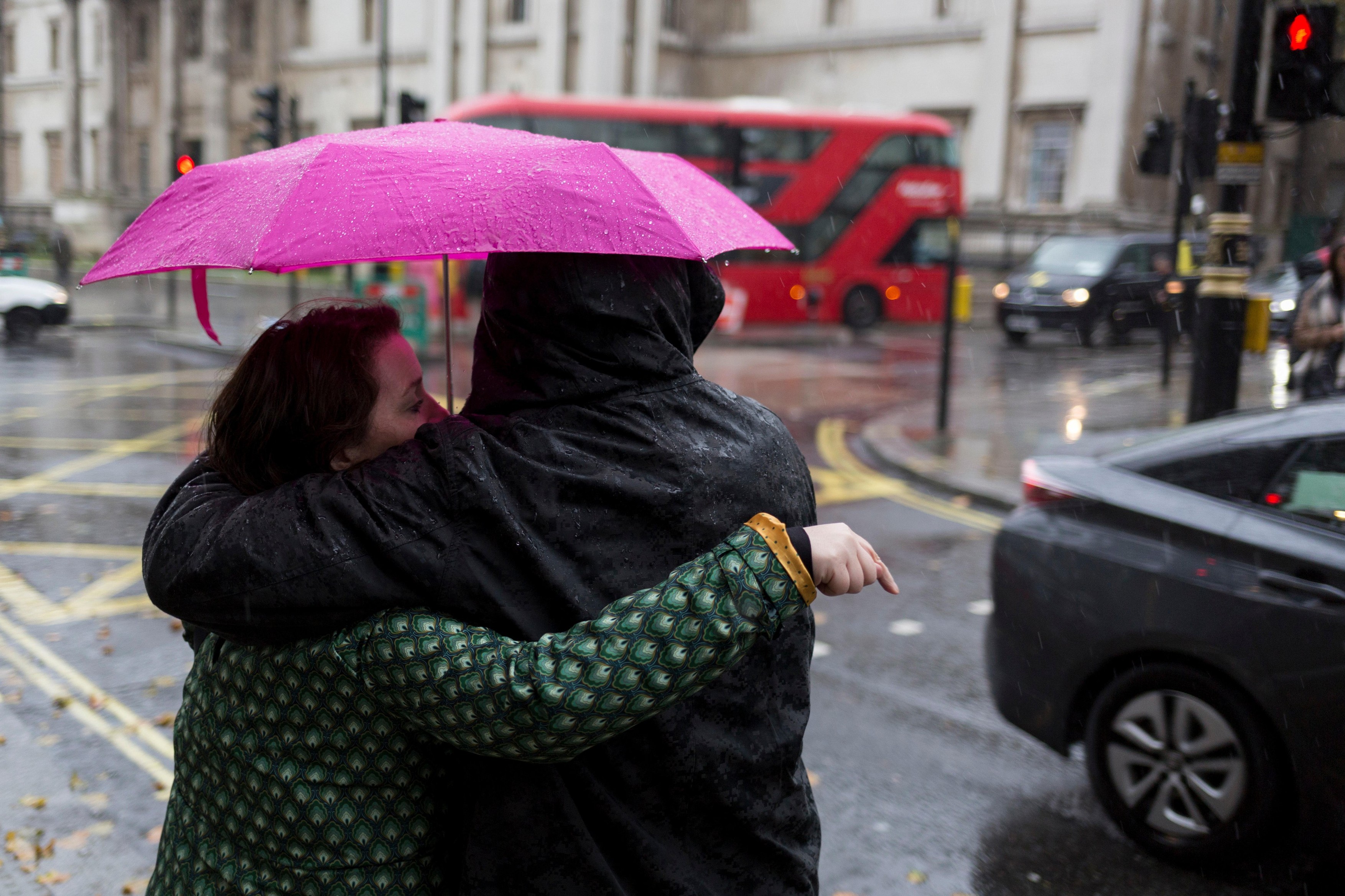 Londoners and visitors to the capital endure heavy rainfall on an autumn afternoon in Trafalgar Square, on 24th October 2019, in Westminster, London, England.