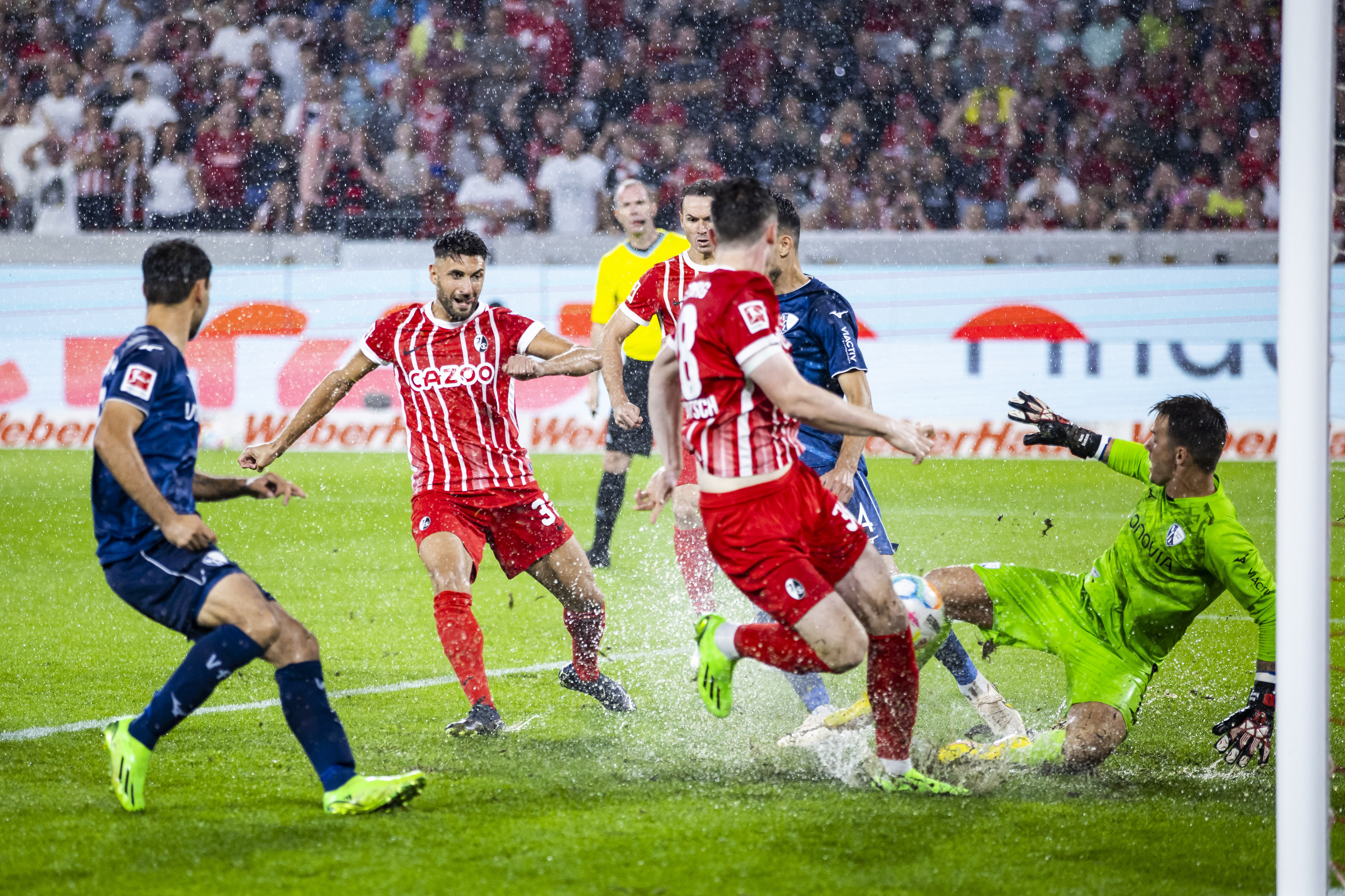 Freiburg's Vincenzo Grifo, second from left scores the opening goal during the German Bundesliga soccer match between SC Freiburg and VfL Bochum in Freiburg, Germany, Friday, Aug. 26, 2022. (Tom Weller/dpa via AP)