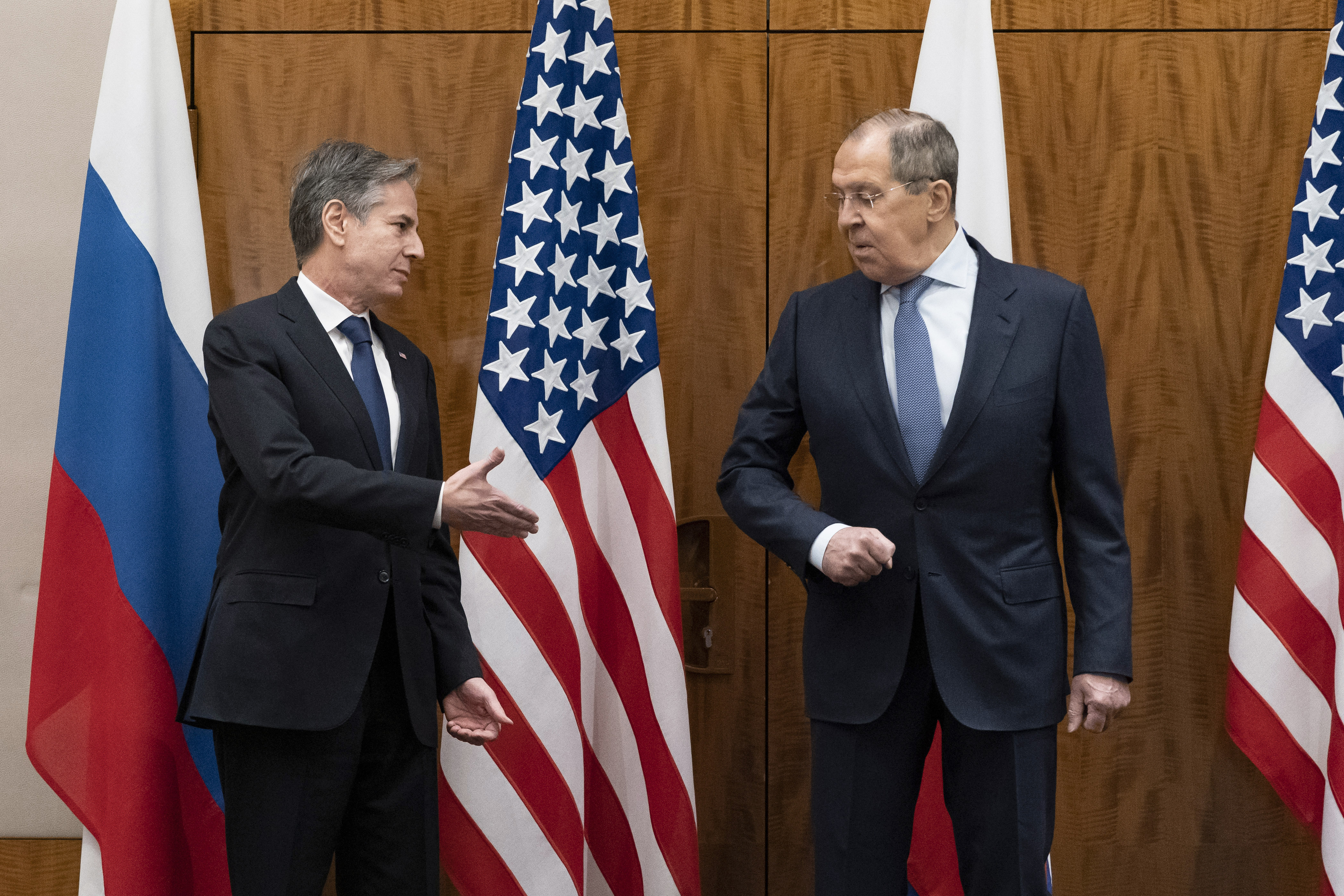 US Secretary of State Antony Blinken, left, greets Russian Foreign Minister Sergey Lavrov before their meeting, in Geneva, Switzerland, Friday, Jan. 21, 2022. (AP Photo/Alex Brandon, Pool)