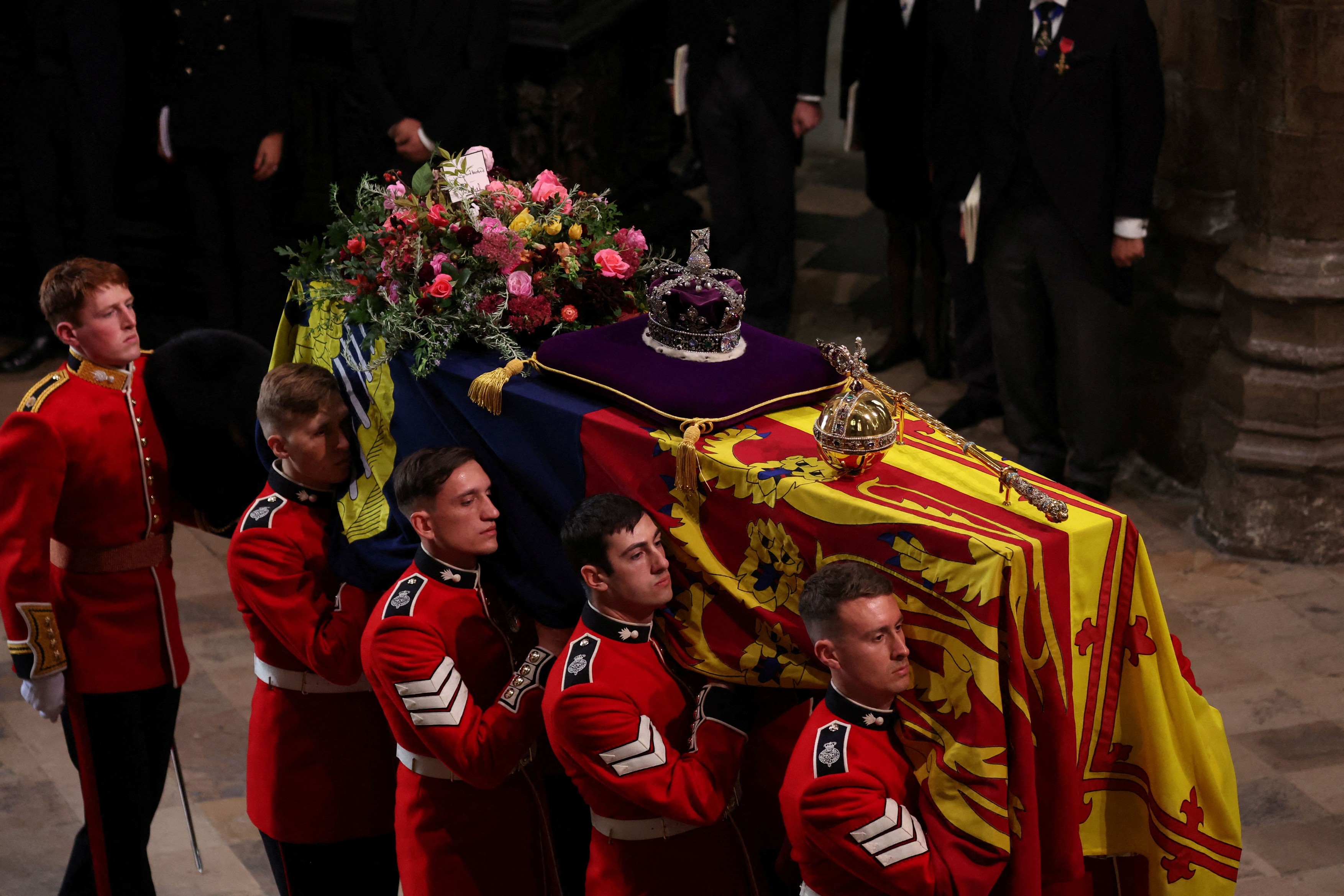 Britain's Queen Elizabeth's coffin is carried, on the day of the state funeral and burial of Britain's Queen Elizabeth, at Westminster Abbey in London, Britain, September 19, 2022.