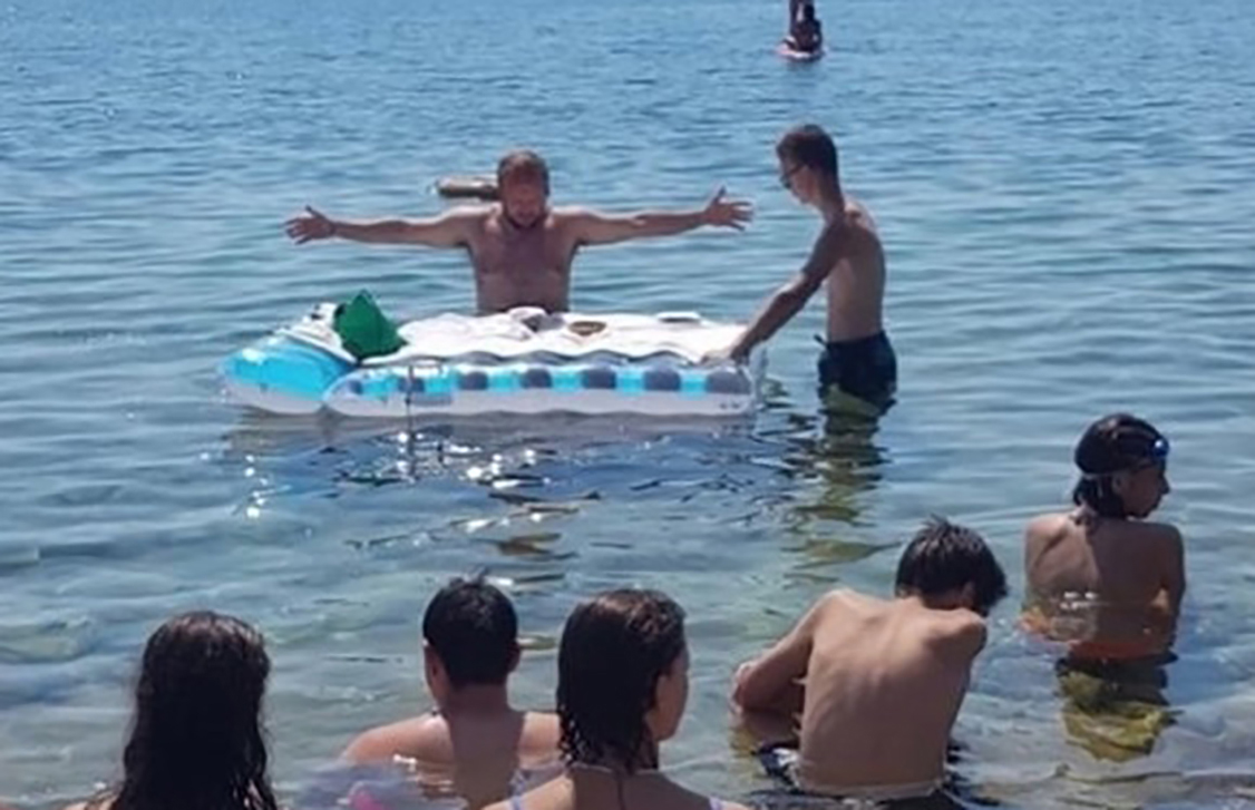 Italy, Crotone ( Calabria region): Heavy temperaturres . Italian priest Mattia Bernasconi celebrates a Mass at sea now, the parish priest is investigated by the Crotone Prosecutor's office for offense to religion (he celebrated breast free)