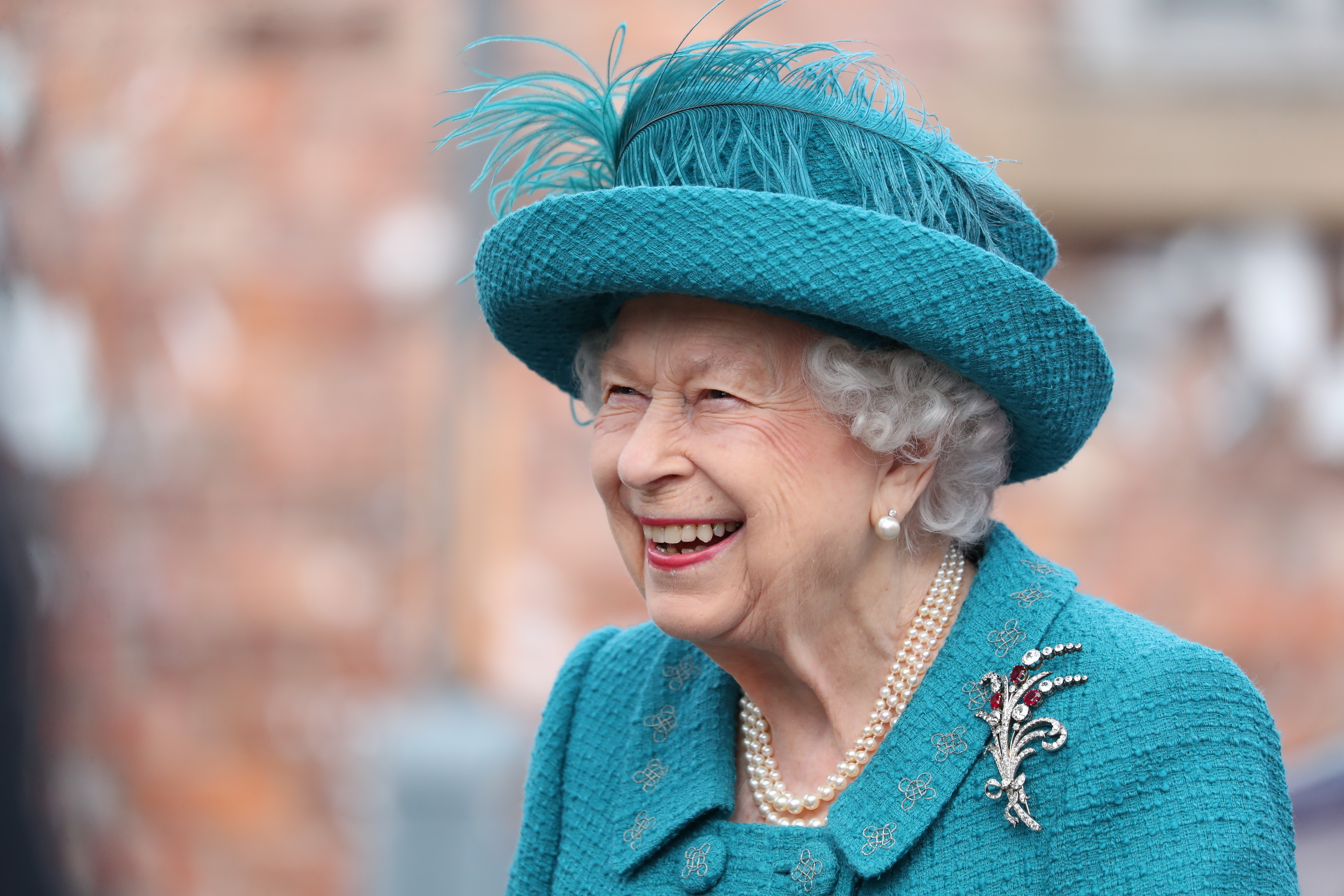 Britain's Queen Elizabeth II visits the set of the long running television series Coronation Street, in Manchester, England, Thursday July 8, 2021. (AP Photo/Scott Heppell)