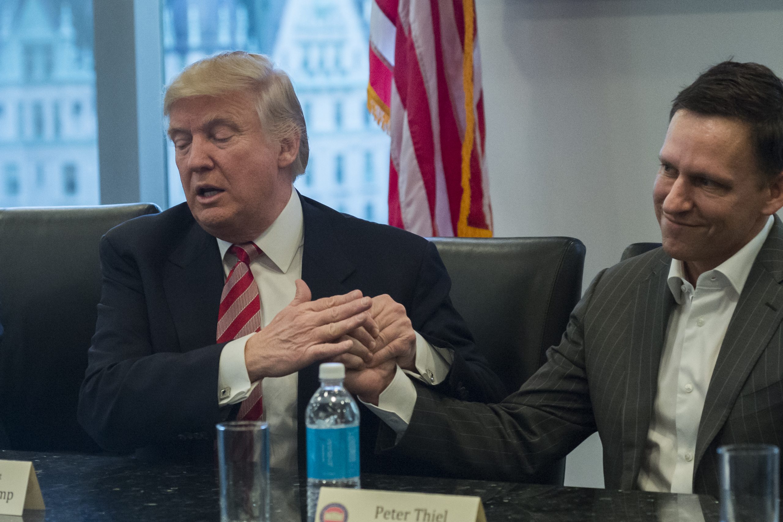 epa05675839 US President-elect Donald Trump (L) and PayPal founder Peter Thiel attend a meeting of technology chiefs in the Trump Organization conference room at Trump Tower in New York, New York, USA, 14 December 2016.  EPA/Albin Lohr-Jones / POOL