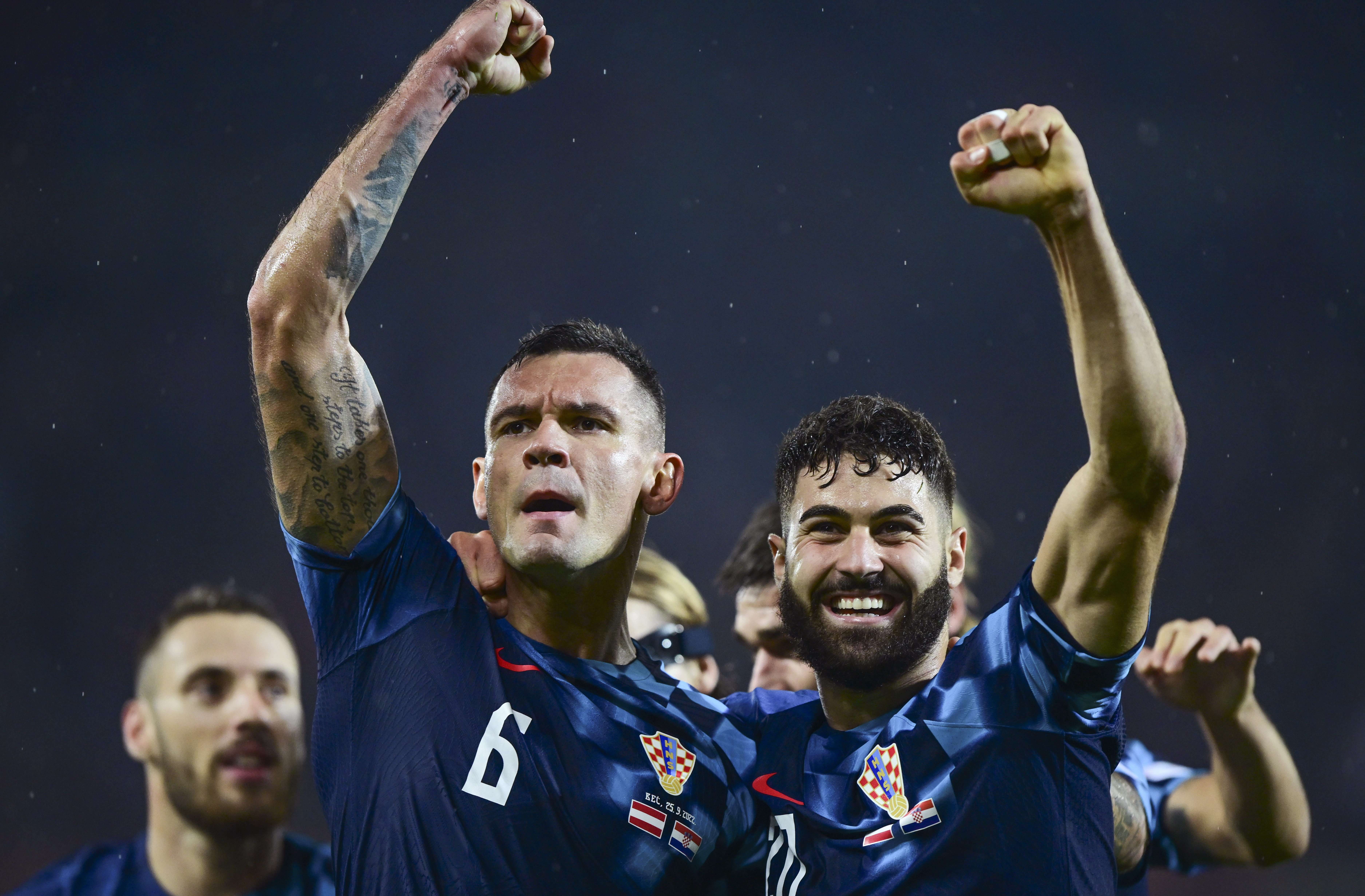 epa10206383 Dejan Lovren (L) of Croatia celebrates with teammate Josko Gvardiol (R) after scoring the 3-1 lead during the UEFA Nations League soccer match between Austria and Croatia in Vienna, Austria, 25 September 2022.  EPA-EFE/CHRISTIAN BRUNA