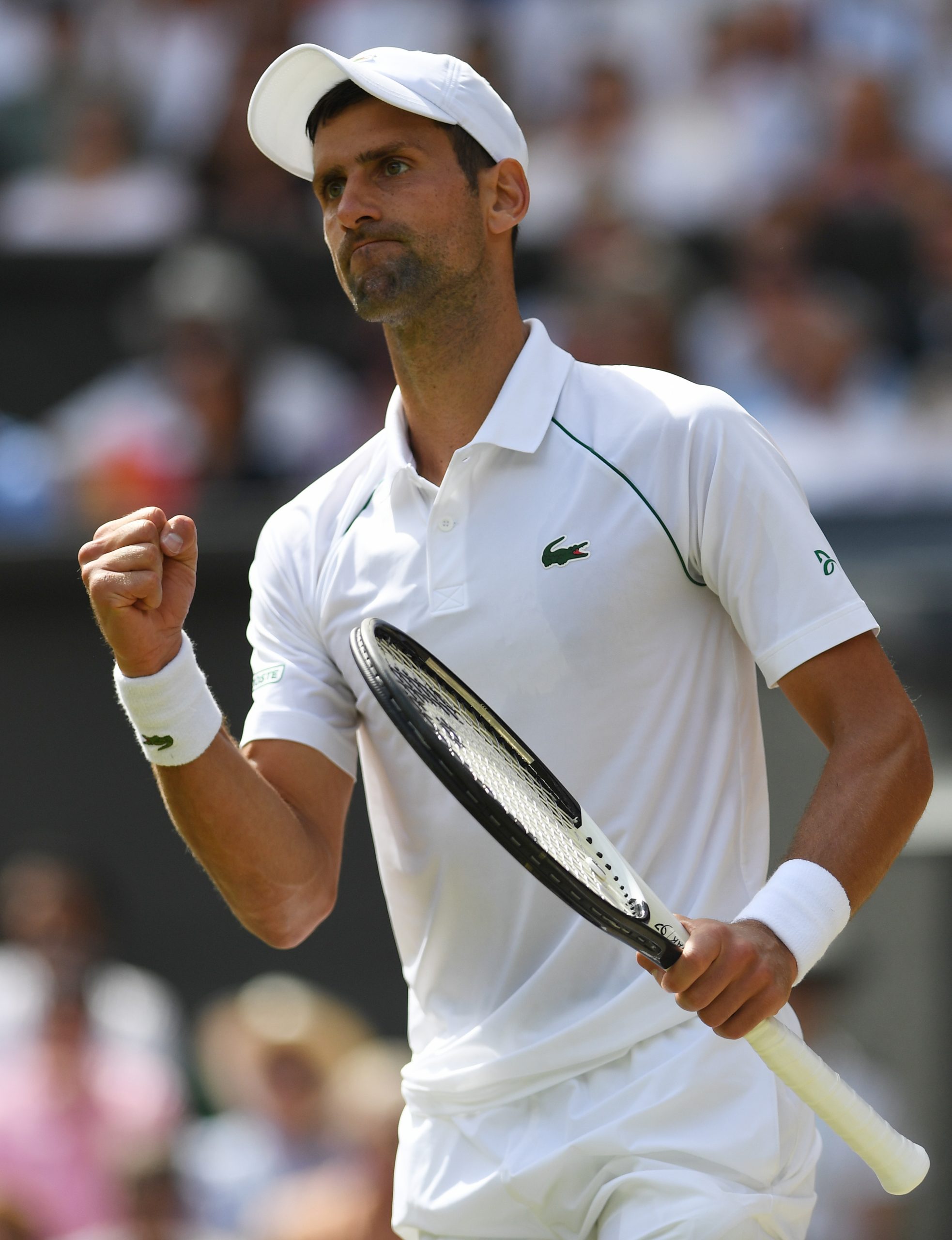 epa10063738 Novak Djokovic of Serbia celebrates winning the second set in the men's final match against Nick Kyrgios of Australia at the Wimbledon Championships, in Wimbledon, Britain, 10 July 2022.  EPA-EFE/NEIL HALL   EDITORIAL USE ONLY