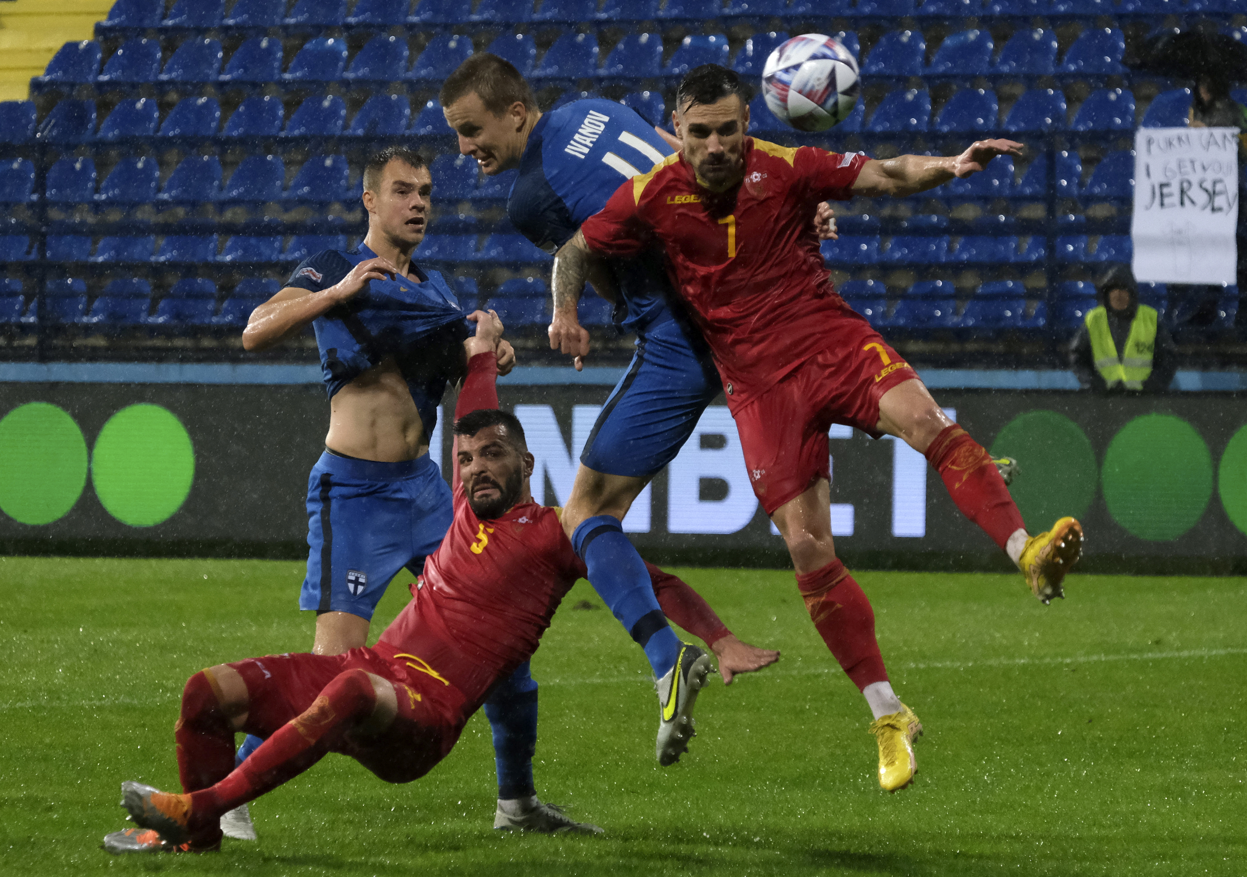 Montenegro's Marko Vesovic, right, duels for the ball with Finland's Robert Ivanov during the UEFA Nations League soccer match between Montenegro and Finland at the City stadium in Podgorica, Montenegro, Monday, Sept. 26, 2022. (AP Photo/Risto Bozovic)