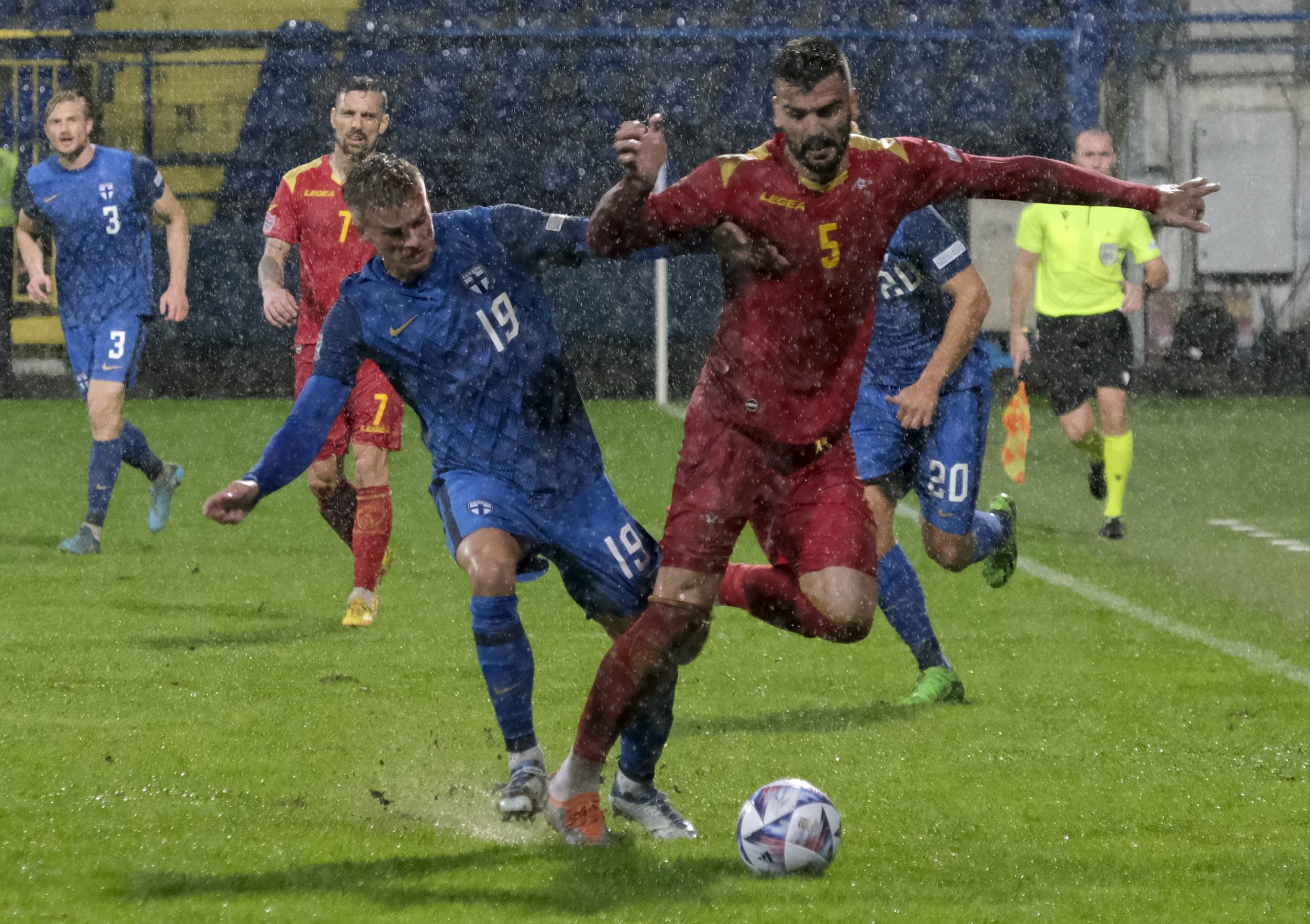 Montenegro's Igor Vujacic, right, duels for the ball with Finland's Marcus Forss during the UEFA Nations League soccer match between Montenegro and Finland at the City stadium in Podgorica, Montenegro, Monday, Sept. 26, 2022. (AP Photo/Risto Bozovic)
