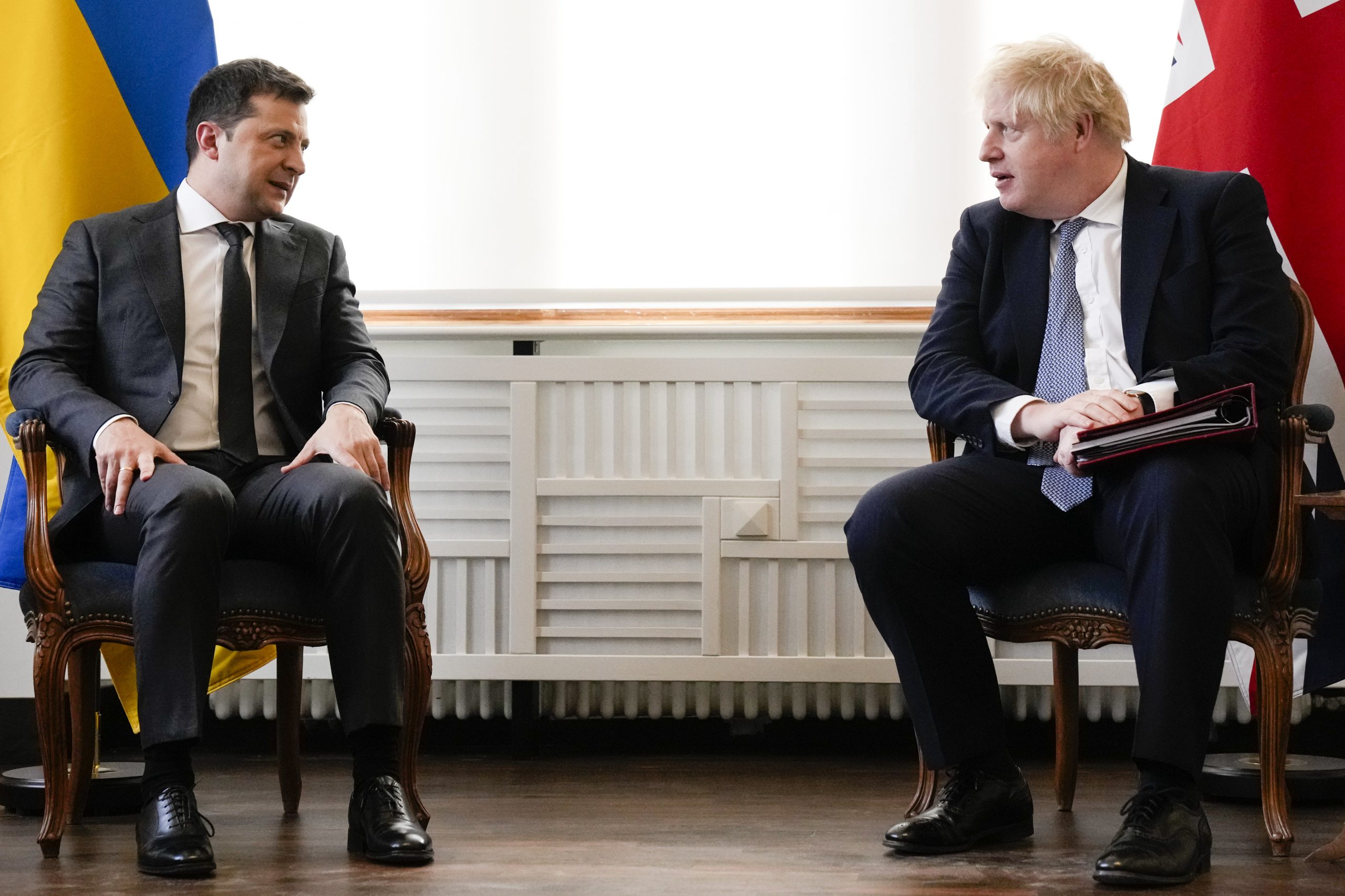 Britain's Prime Minister Boris Johnson, right, and Ukrainian President Volodymyr Zelenskyy meet for talks during the Munich Security Conference in Munich, Germany, Saturday, Feb. 19, 2022. (AP Photo/Matt Dunham, Pool)
