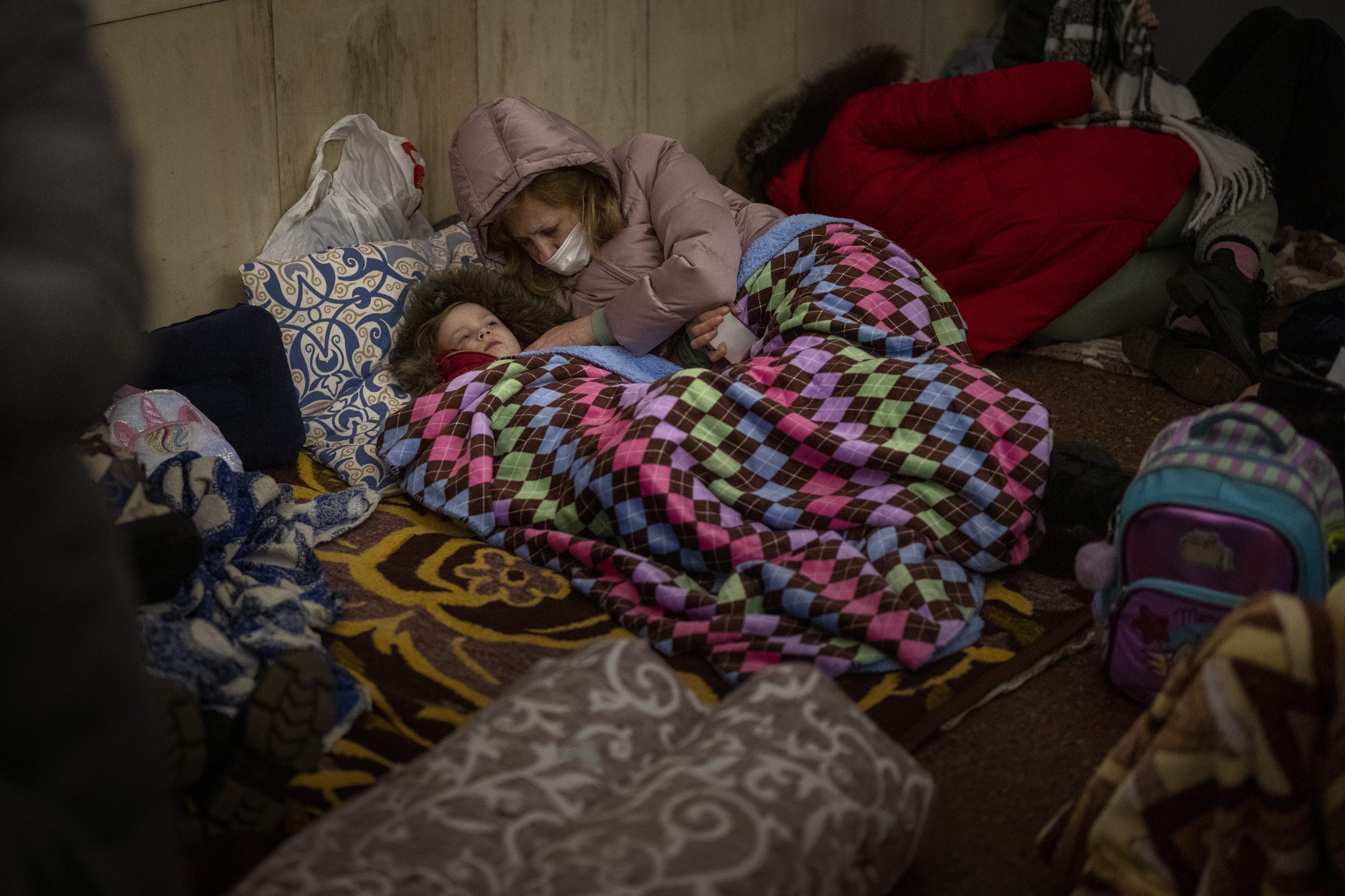 People rest in the Kyiv subway, using it as a bomb shelter in Kyiv, Ukraine, Thursday, Feb. 24, 2022. (AP Photo/Emilio Morenatti)