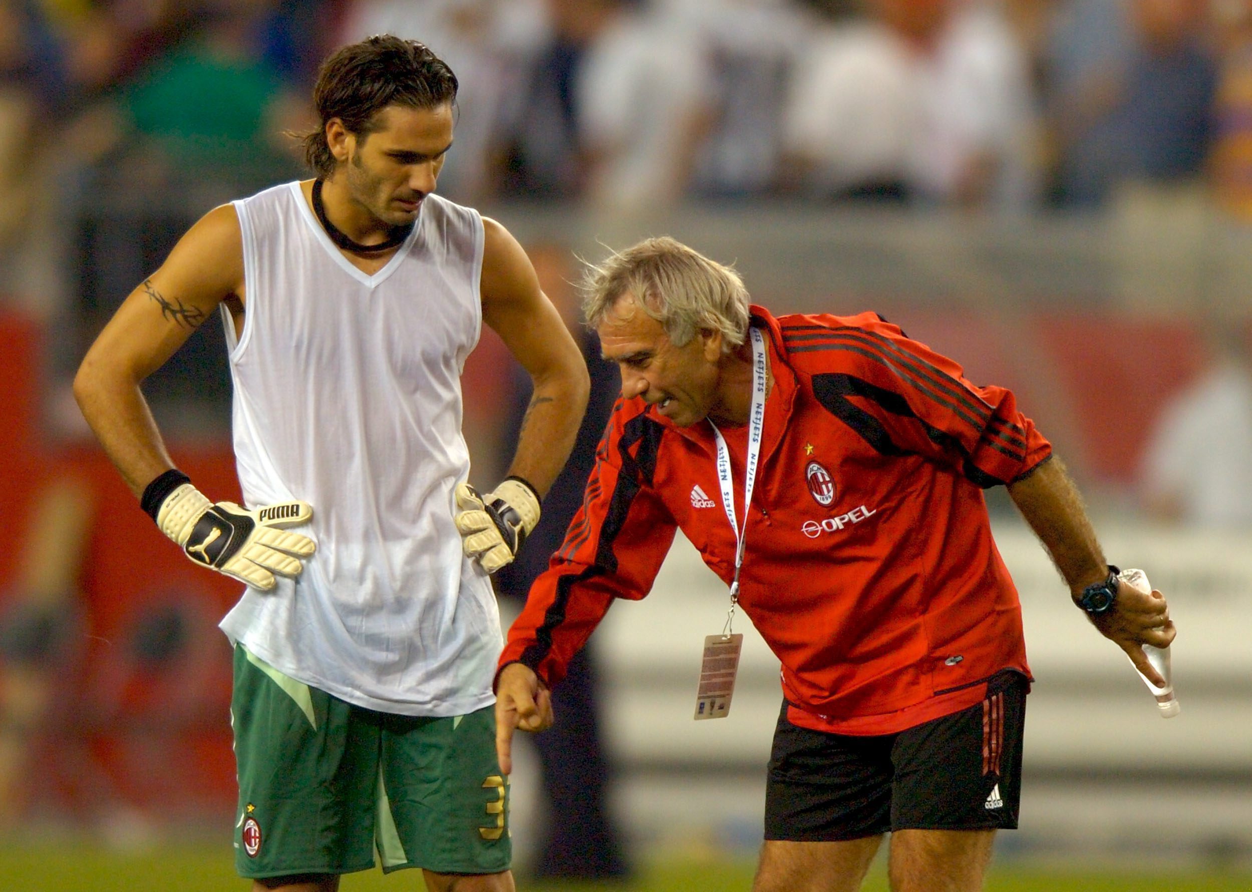 epa000488870 AC Milan's goal keeper coach Villiam Vecchi (R) talks with  Dimitrios Eleftheropoulos (L) after AC Milan lost 1-0 to Chelsea at Gillette Stadium in Foxboro Massachusetts Sunday 24 July 2005.  EPA/CJ GUNTHER