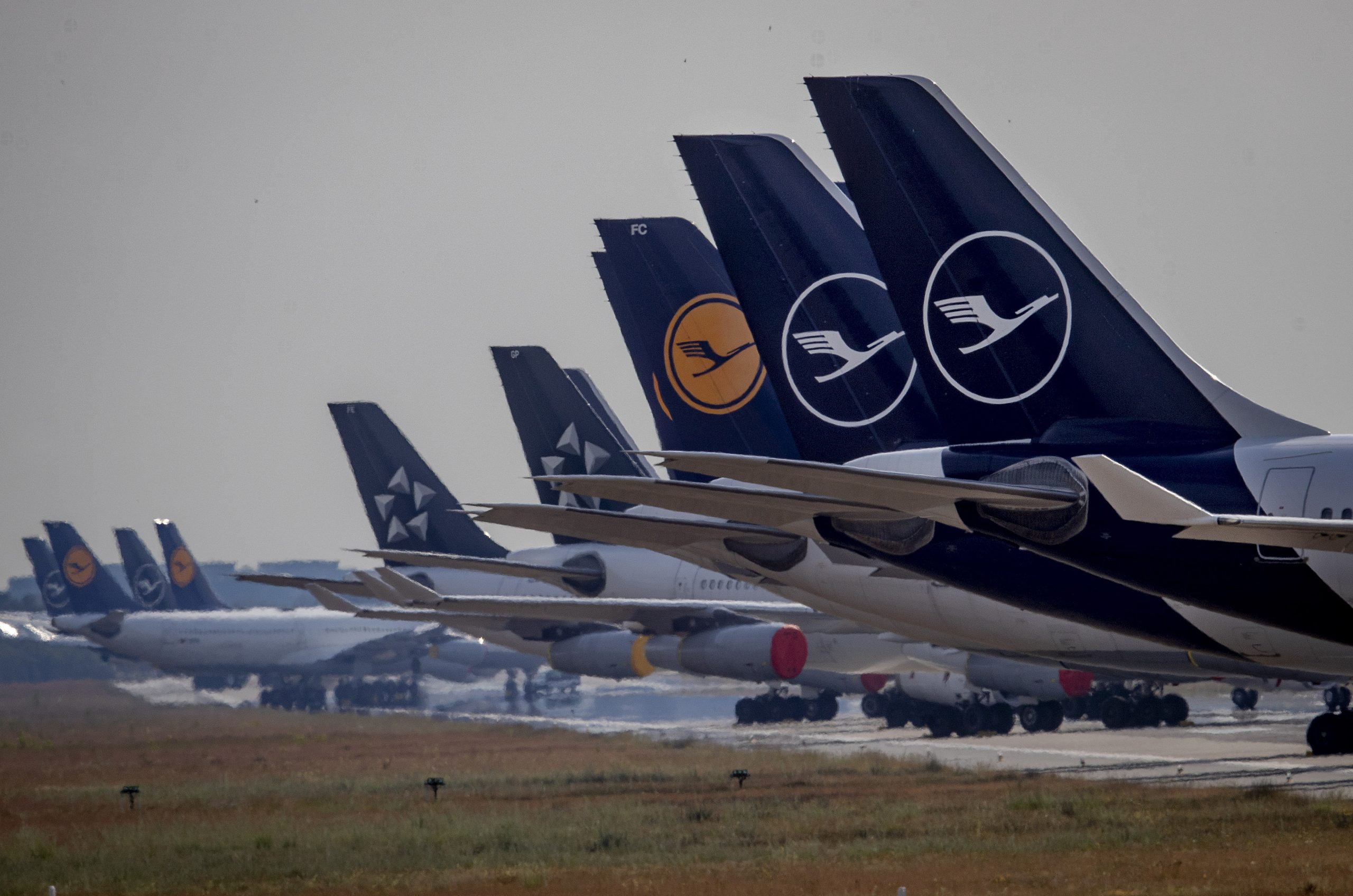 Lufthansa aircrafts are parked on a runway at the airport in Frankfurt, Germany, Wednesday, June 3, 2020. Due to the coronavirus the airline had to cancel 95 percent of its flights recently. (AP Photo/Michael Probst)