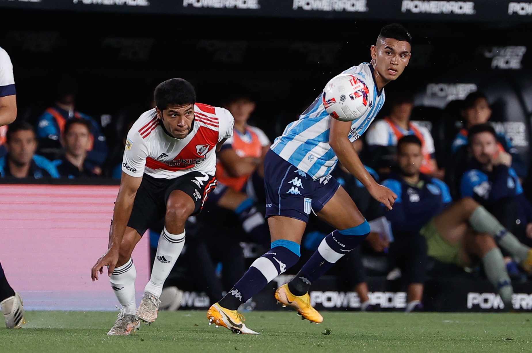 epa09604063 River Plate's Robert Rojas (L) in action against Racing Club's Carlos Alcaraz (R), during a soccer match for the Argentine Professional League, in Buenos Aires, Argentina, 25 November 2021.  EPA-EFE/Juan Ignacio Roncoroni