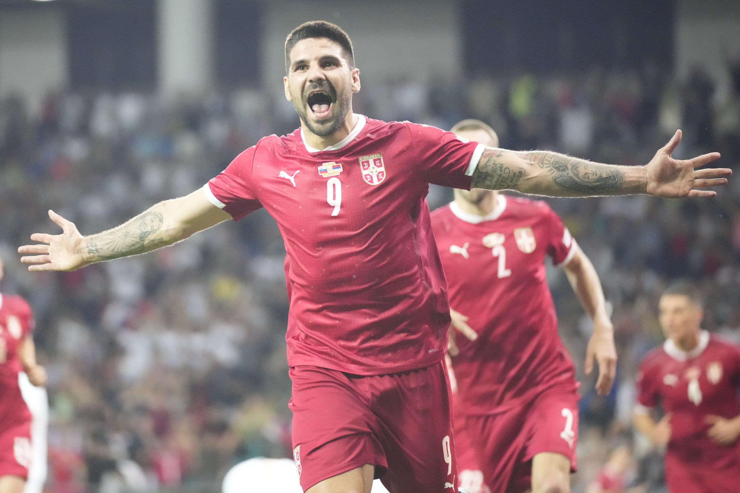 Serbia's Aleksandar Mitrovic celebrates after scoring his side's second goal during the UEFA Nations League soccer match between Slovenia and Serbia at Stozice stadium in Ljubljana, Slovenia, Sunday, June 12, 2022. (AP Photo/Darko Bandic)