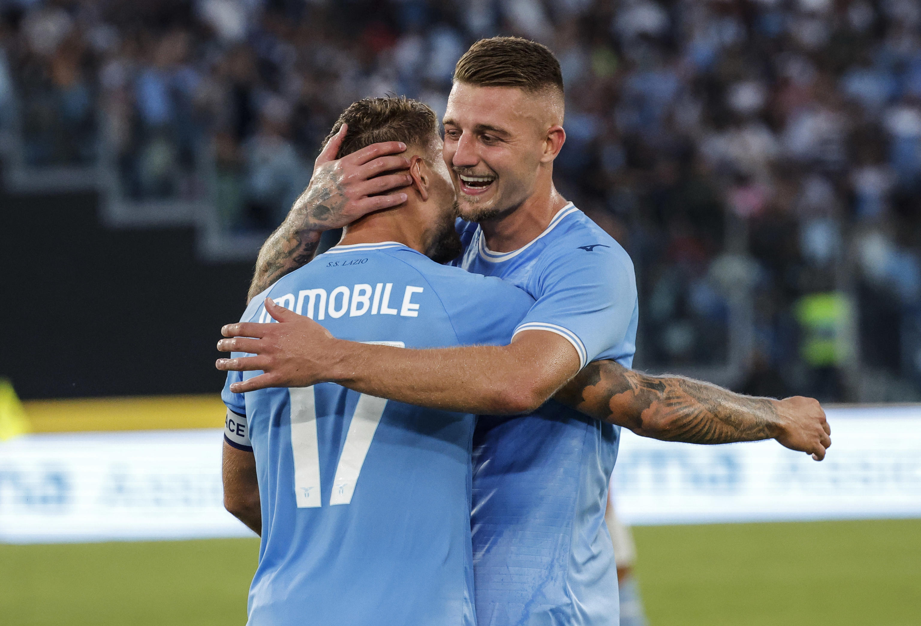 epa10121165 Lazio?s Ciro Immobile (L) and Lazio?s Sergej Milinkovic-Savic celebrate the 2-1 during the Italian Serie A soccer match SS Lazio vs Bologna FC at the Olimpico stadium in Rome, Italy, 14 August 2022.  EPA-EFE/GIUSEPPE LAMI
