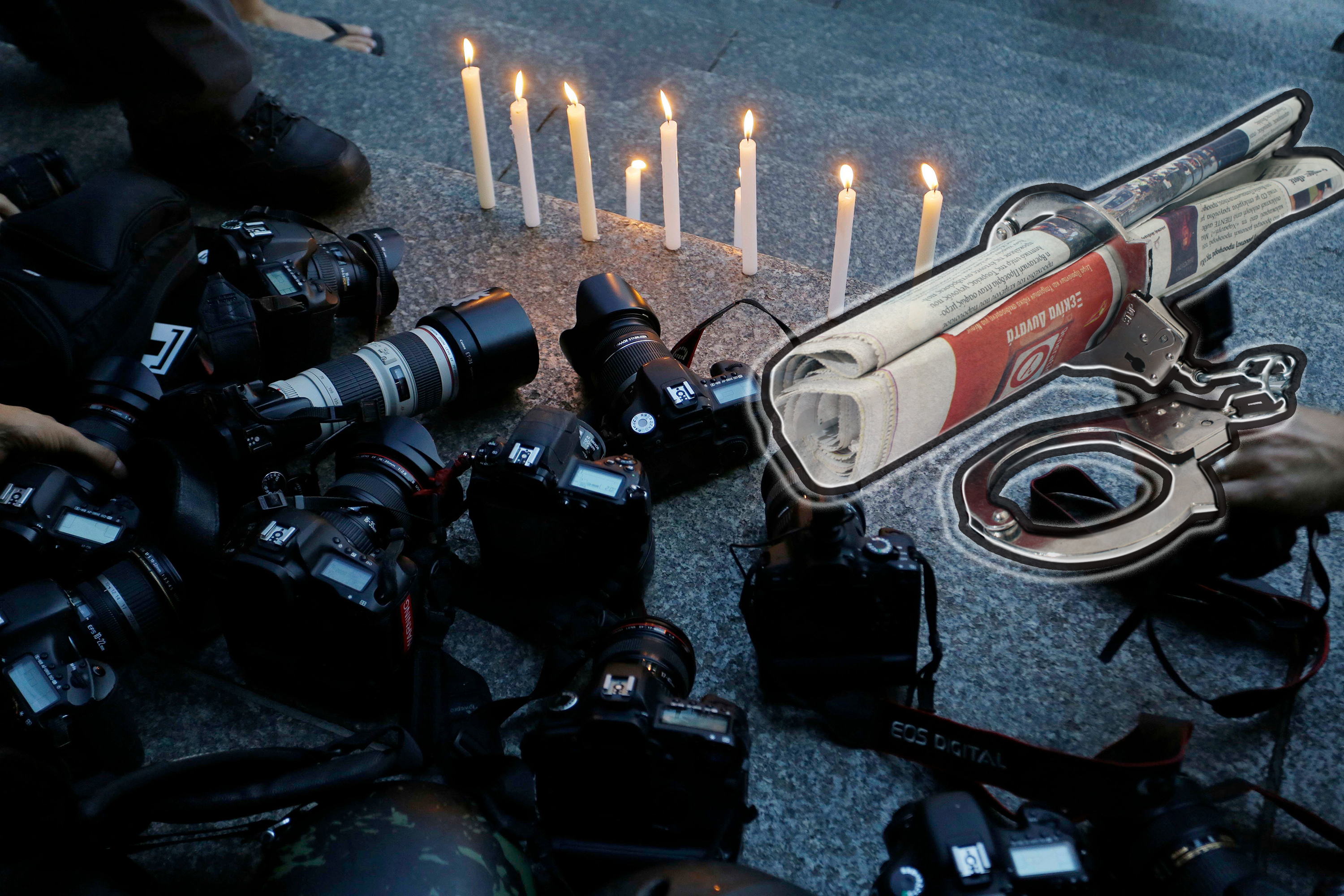 Sao Paulo, SP / Brazil - February 12, 2014: Photojournalists light candles during a vigil after a video journalist get killed while covering a protest in Rio de Janeiro.