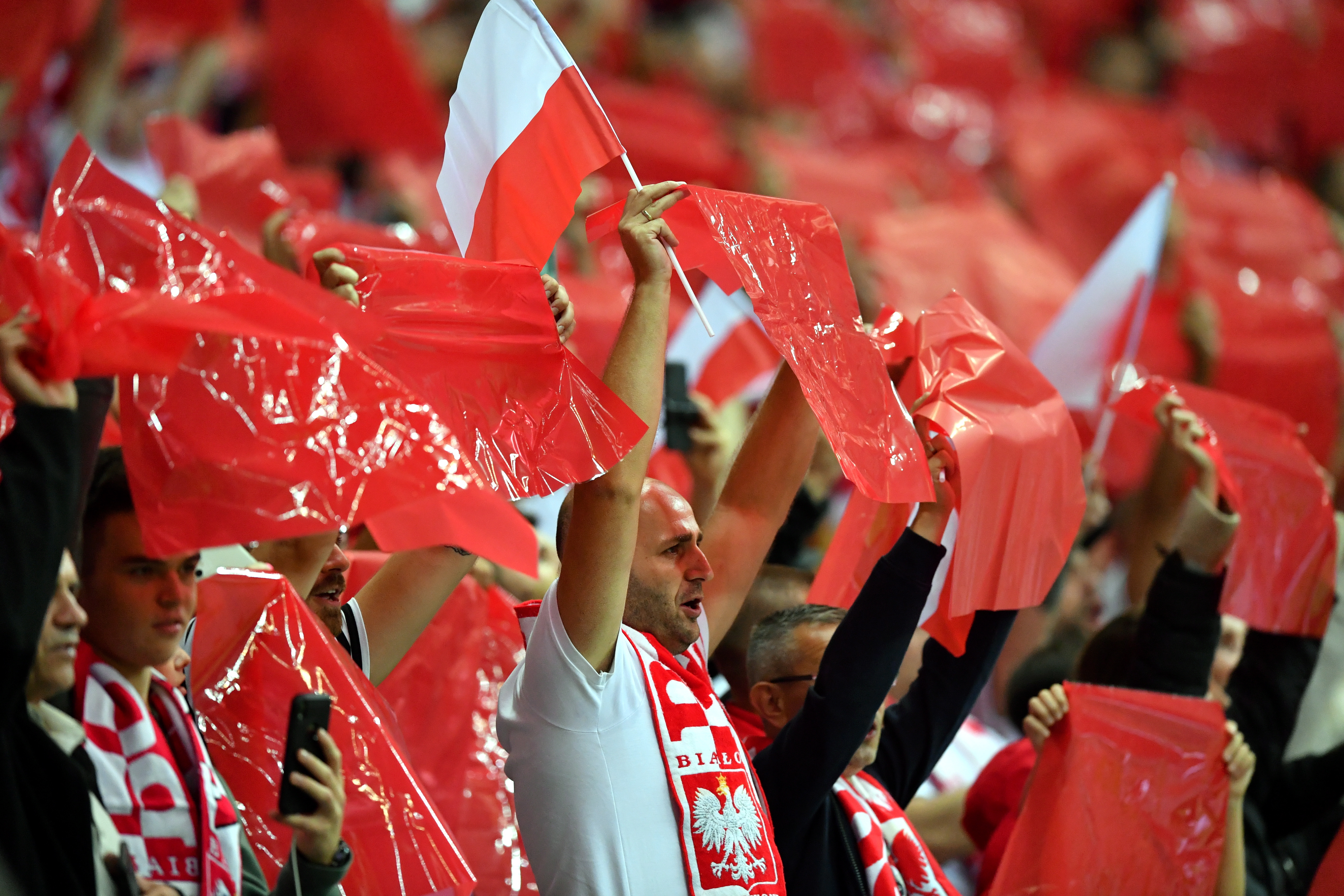 epa09456043 Fans of Poland cheer prior to the FIFA World Cup 2022 qualifying group I soccer match between Poland and England at PGE Narodowy stadium in Warsaw, Poland, 08 September 2021.  EPA-EFE/Piotr Nowak POLAND OUT