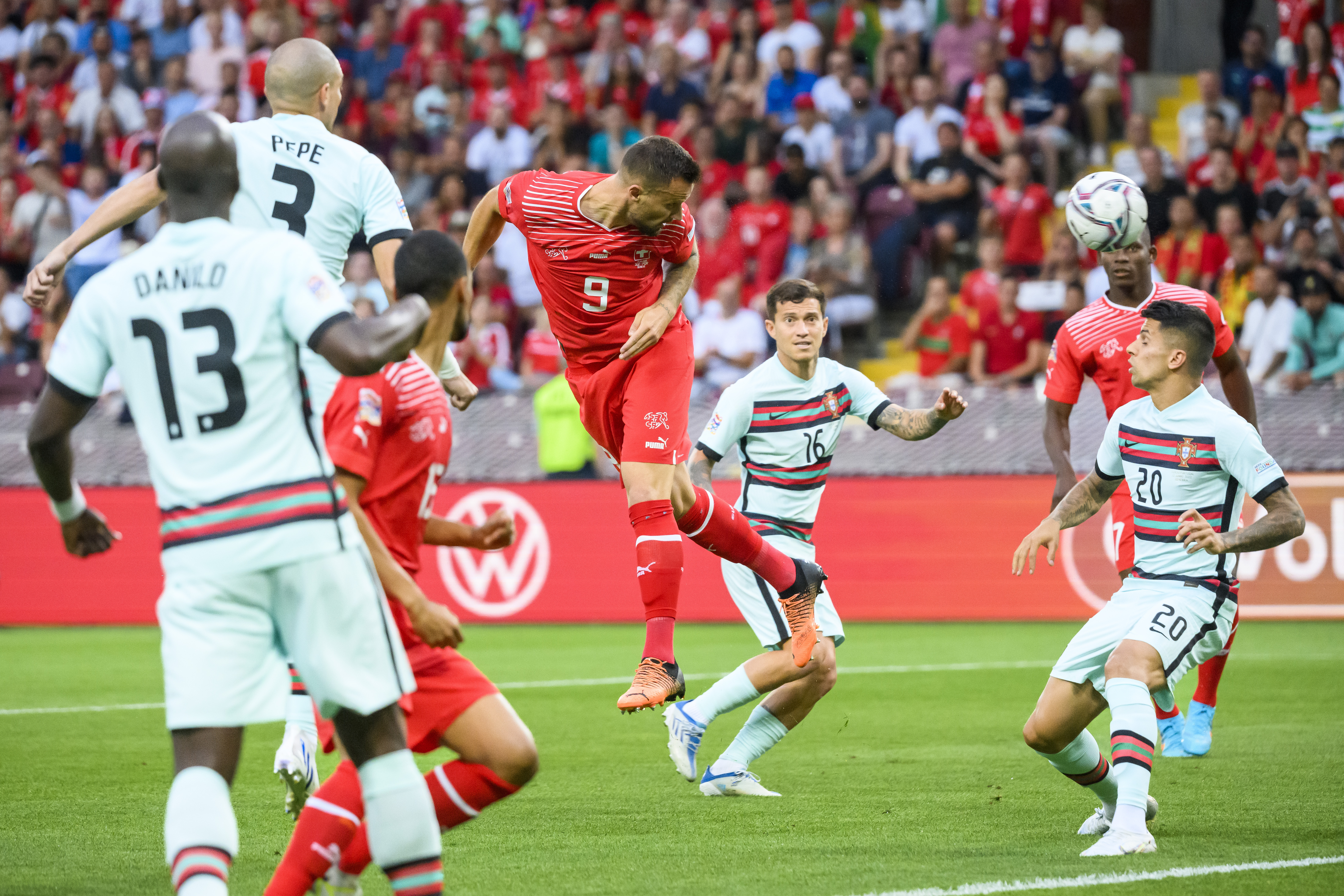 epa10009946 Switzerland's forward Haris Seferovic (C) scores the opening goal during the UEFA Nations League soccer match between Switzerland and Portugal at the Stade de Geneve stadium, in Geneva, Switzerland, 12 June 2022.  EPA-EFE/JEAN-CHRISTOPHE BOTT