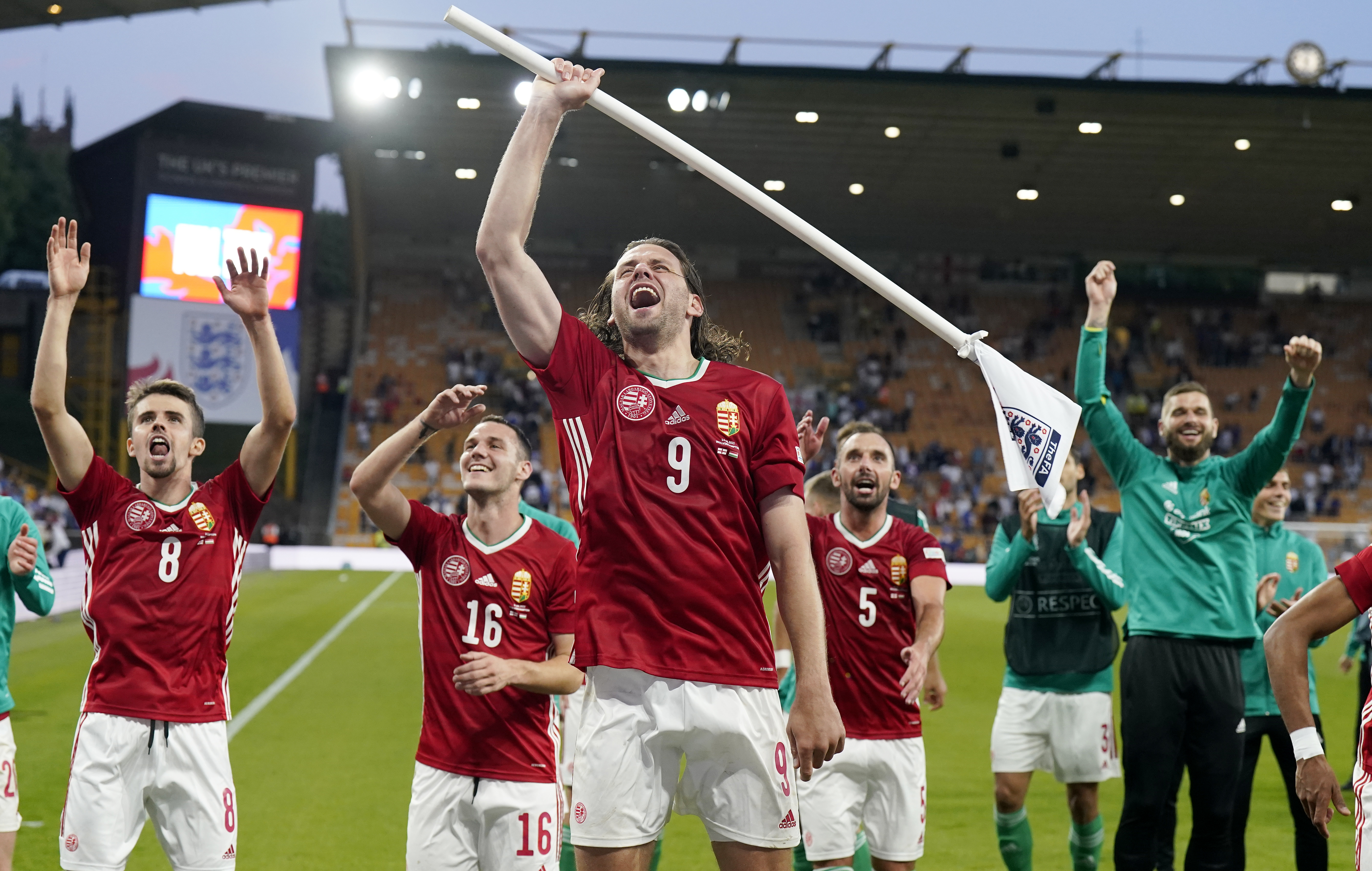 epa10013506 Hungary captain Adam Szalai (C) and teammates celebrate with their fans after they beat England in the UEFA Nations League soccer match between England and Hungary in Wolverhampton, Britain, 14 June 2022. Hungary won 4-0.  EPA-EFE/ANDREW YATES