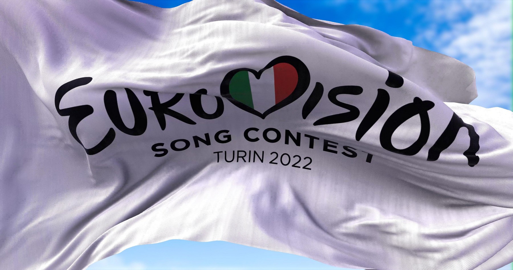 Turin, Italy, January 2022: the white flag with the Eurovision Song Contest 2022 logo waving in the wind. The 2022 edition will take place in Turin, I