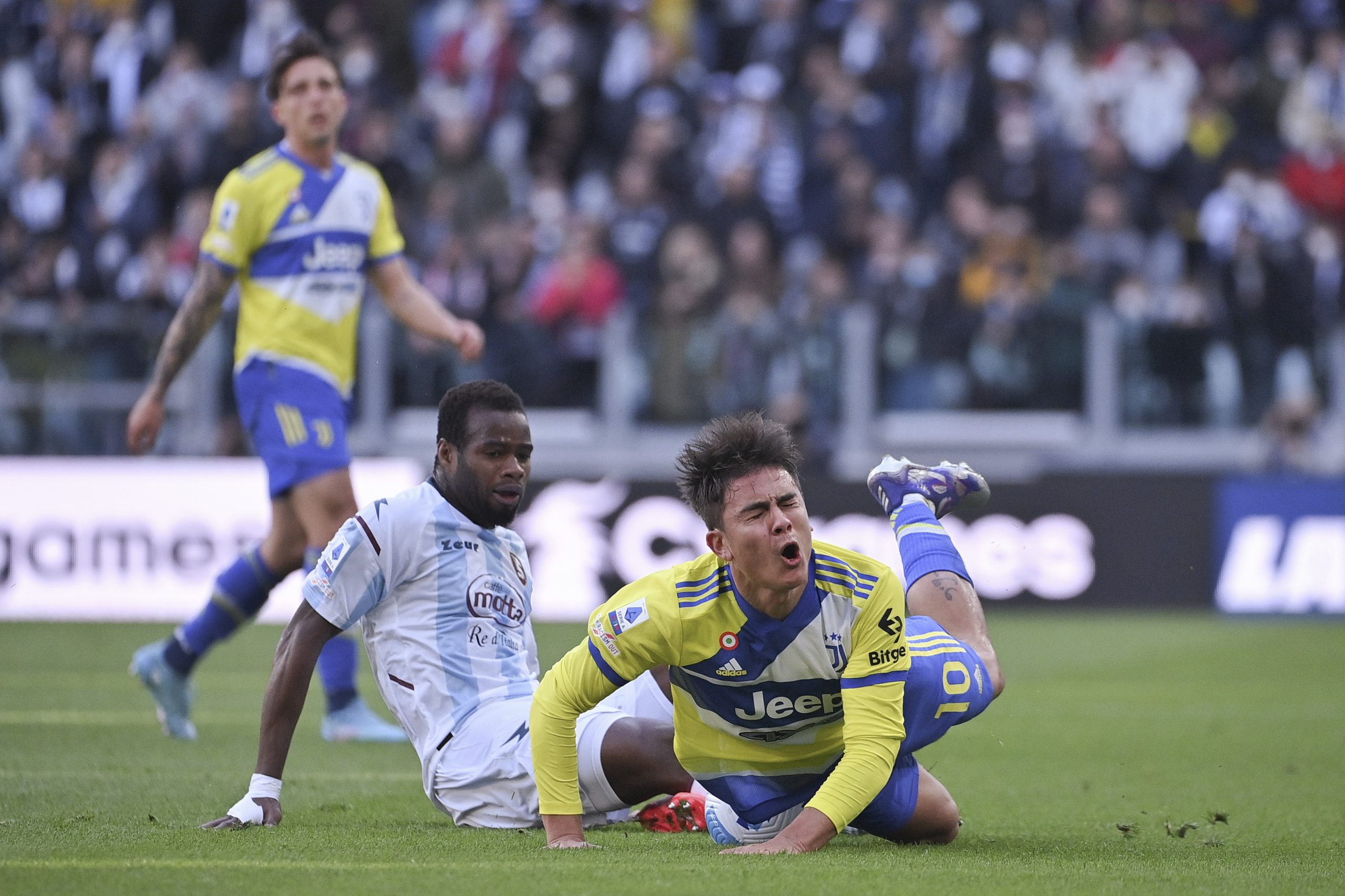 Juventus' Paulo Dybala, right, is challenged by Salernitana's Lassana Coulibaly during the Serie A soccer match between Juventus and Salernitana, at the Allianz stadium in Turin, Italy, Sunday, March 20, 2021. (Marco Alpozzi/LaPresse via AP)