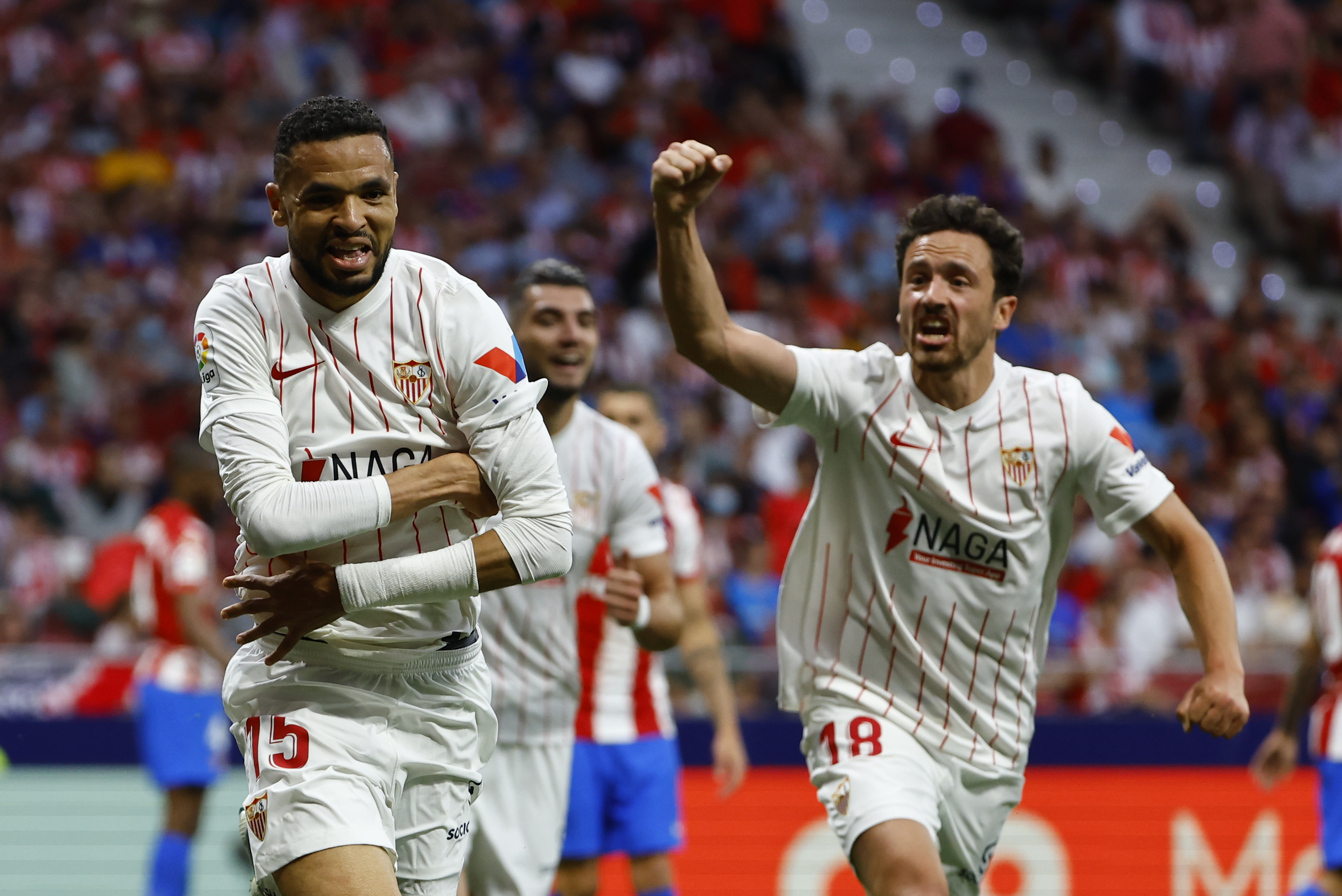 epa09949712 Sevilla's Youssef En-Nesyri (L) celebrates after scoring the 1-1 equalizer during the Spanish LaLiga soccer match between Atletico Madrid and Sevilla FC in Madrid, Spain, 15 May 2022.  EPA-EFE/Sergio Perez