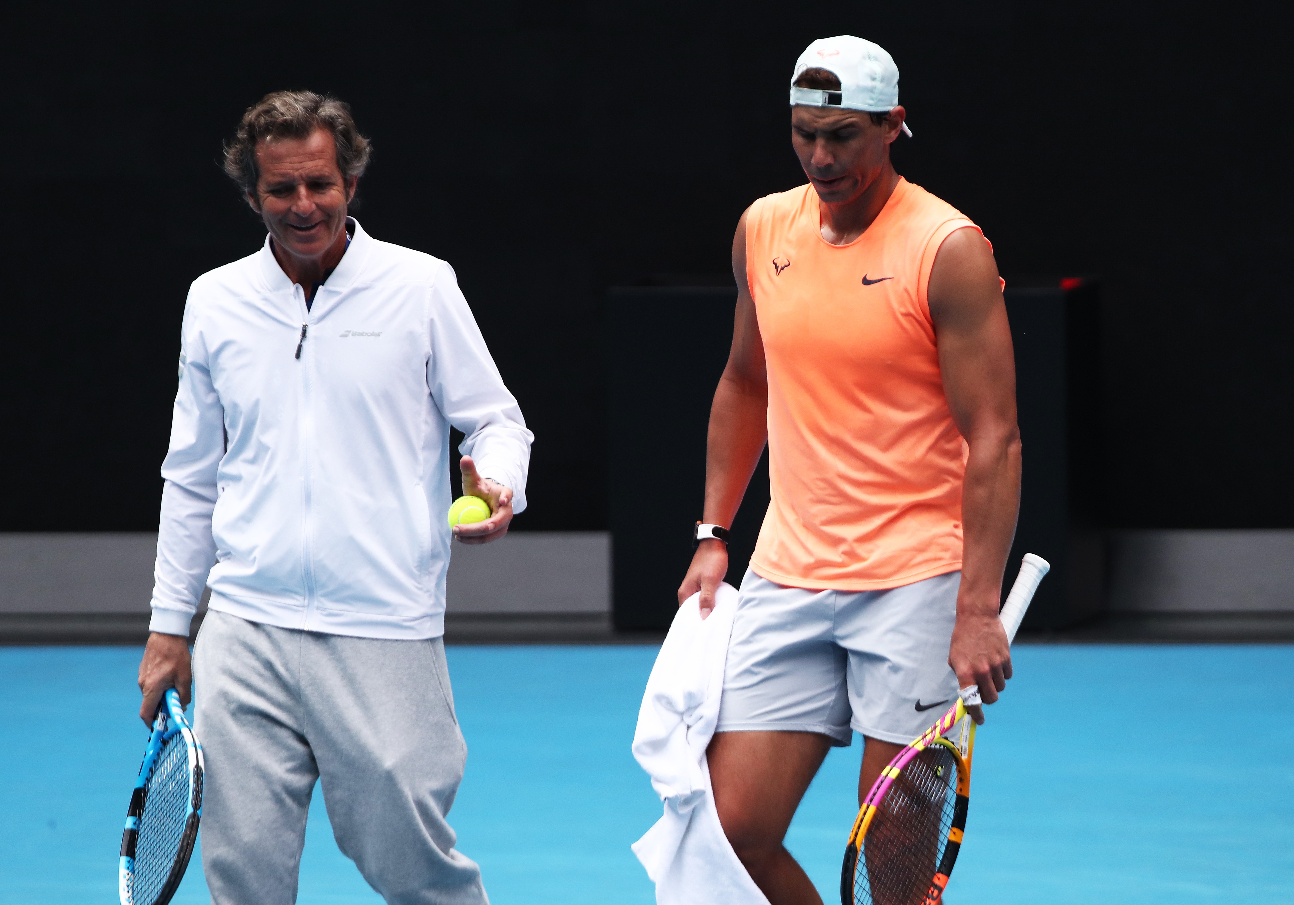 epa08993016 Rafael Nadal (R) of Spain walks with Coach Francis Roig (L) during a practise session ahead of the Australian Open Grand Slam tennis tournament, in Melbourne, Australia, 07 February 2021.  EPA-EFE/JASON O'BRIEN