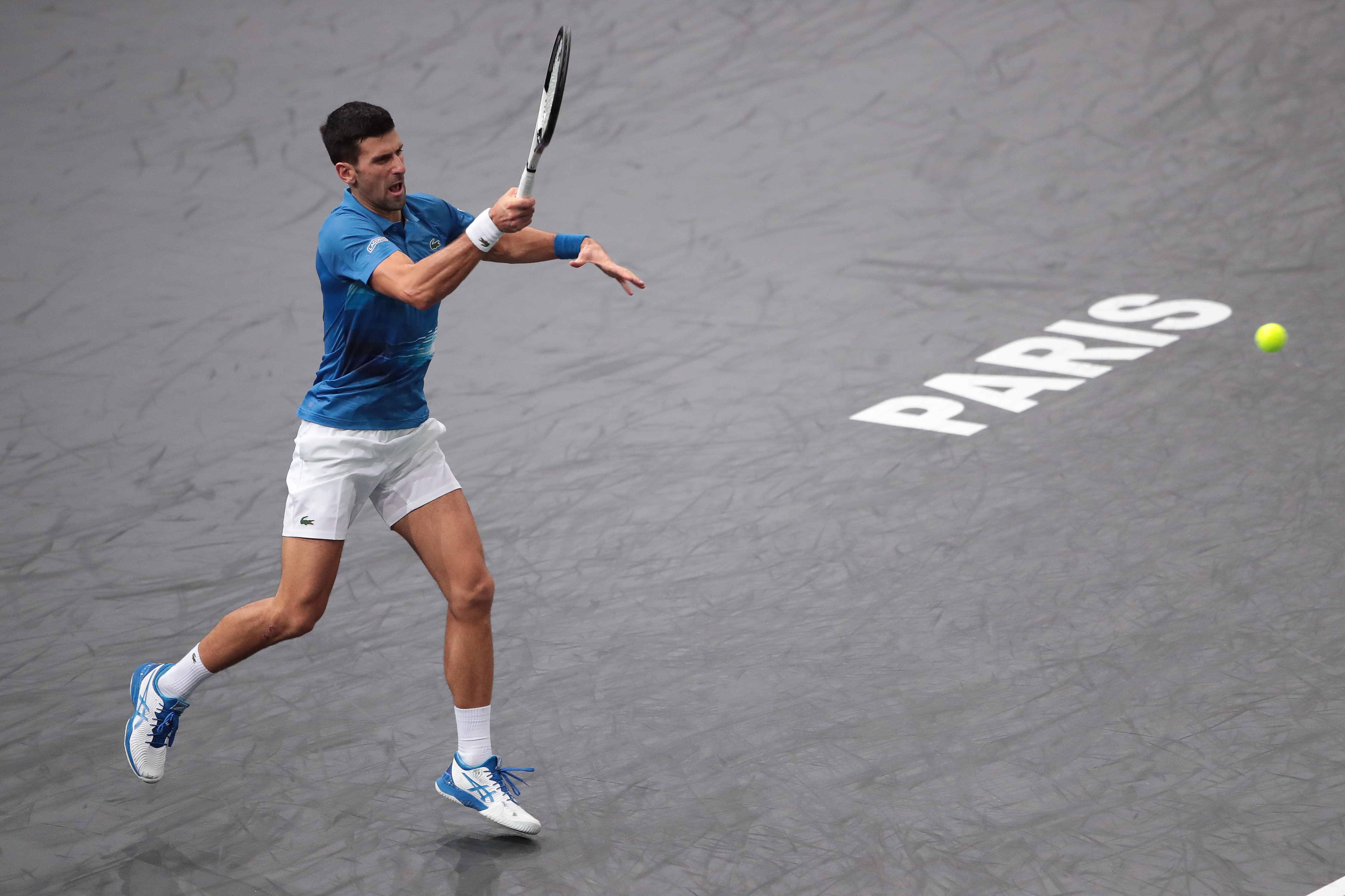 epa10279361 Novak Djokovic of Serbia in action against Maxime Cressy of the US during their match at the Rolex Paris Masters 2022 Tennis Tournament in Paris, France, 01 November 2022.  EPA-EFE/CHRISTOPHE PETIT TESSON