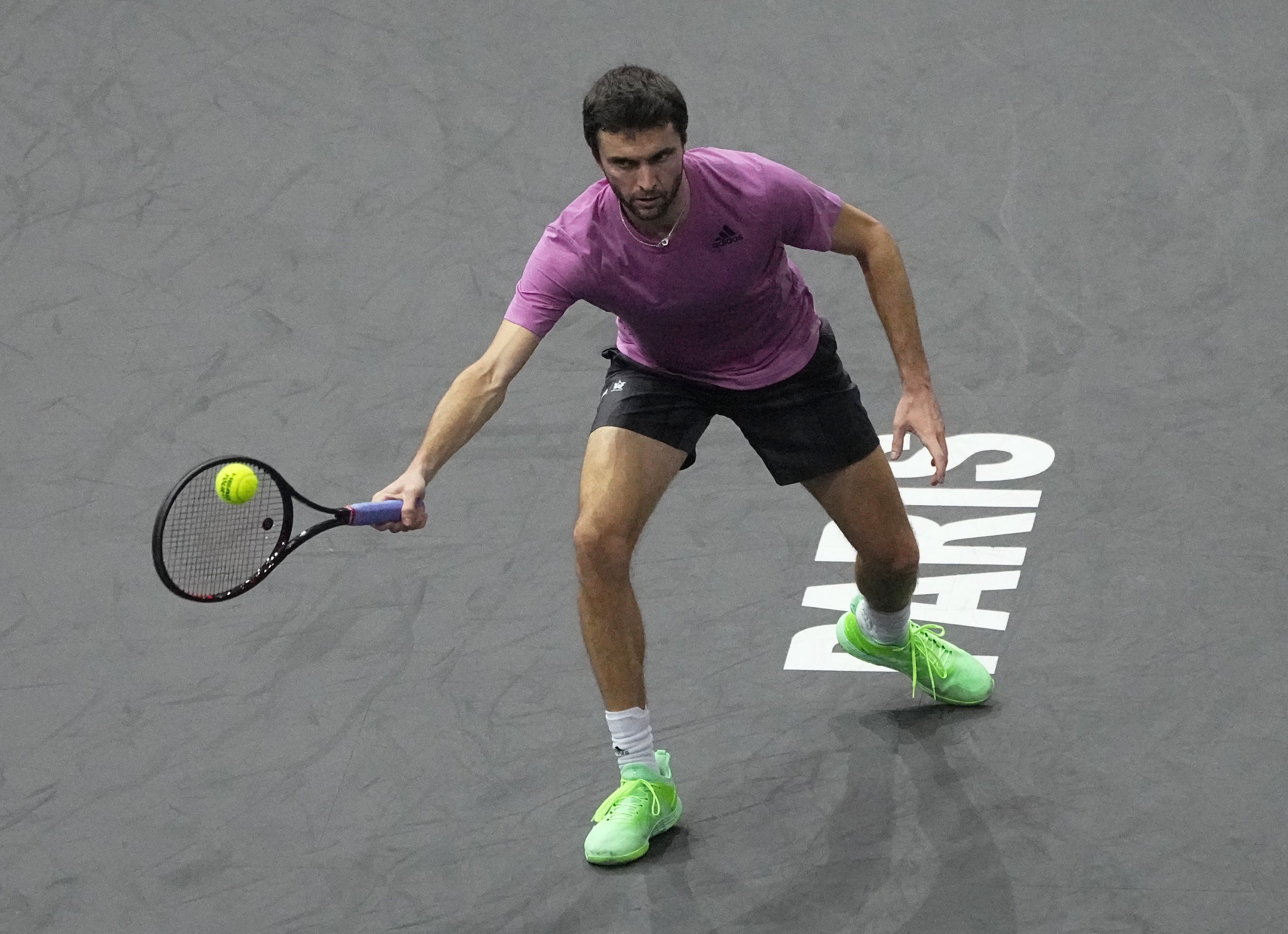 Gilles Simon of France returns the ball to Taylor Fritz of the United States during their second round match of the Paris Masters tennis tournament at the Accor Arena, Wednesday, Nov. 2, 2022 in Paris. (AP Photo/Michel Euler)