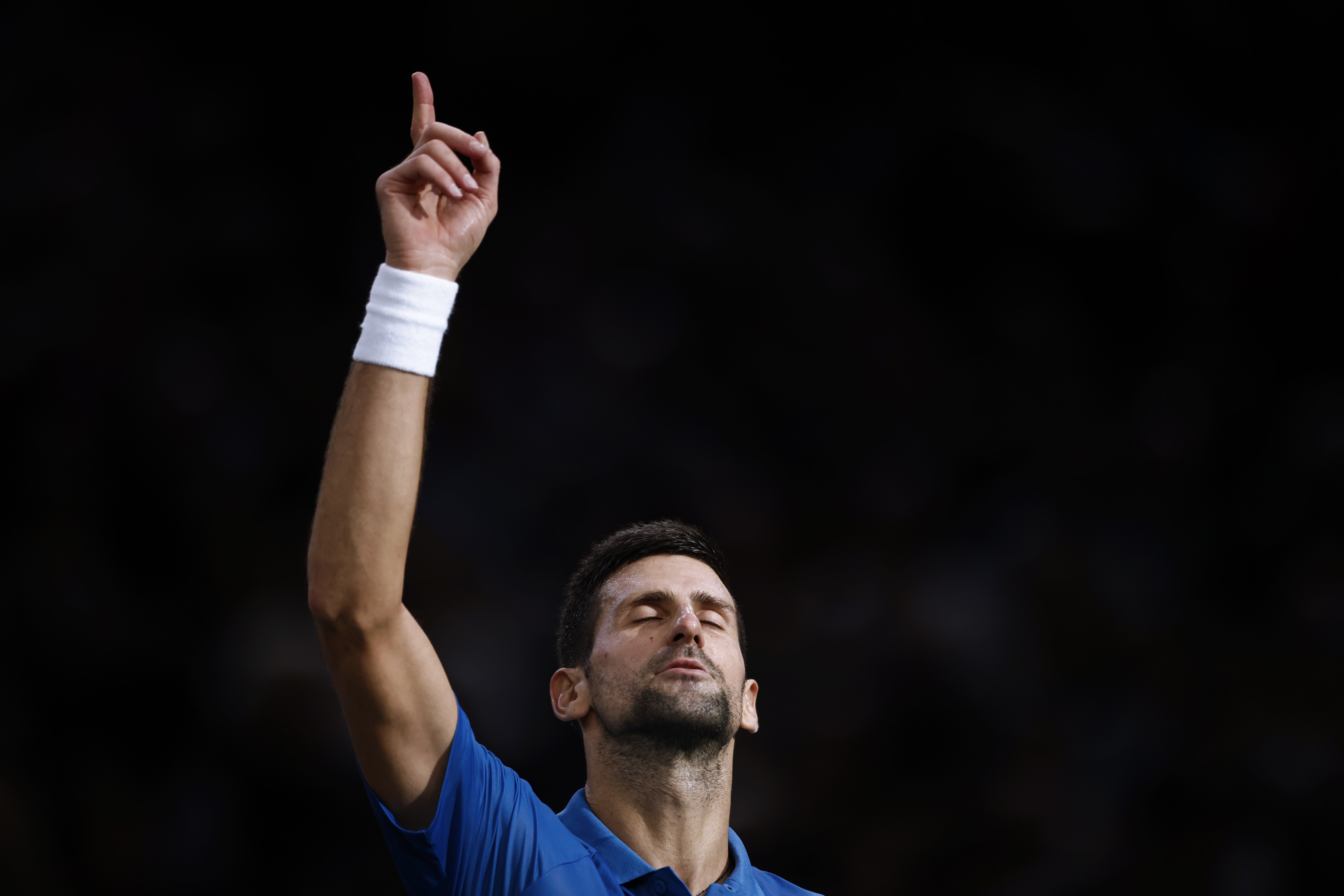 epa10288475 Novak Djokovic of Serbia celebrates winning his semifinal match against Stefanos Tsitsipas of Greece at the Rolex Paris Masters tennis tournament in Paris, France, 05 November 2022.  EPA-EFE/YOAN VALAT