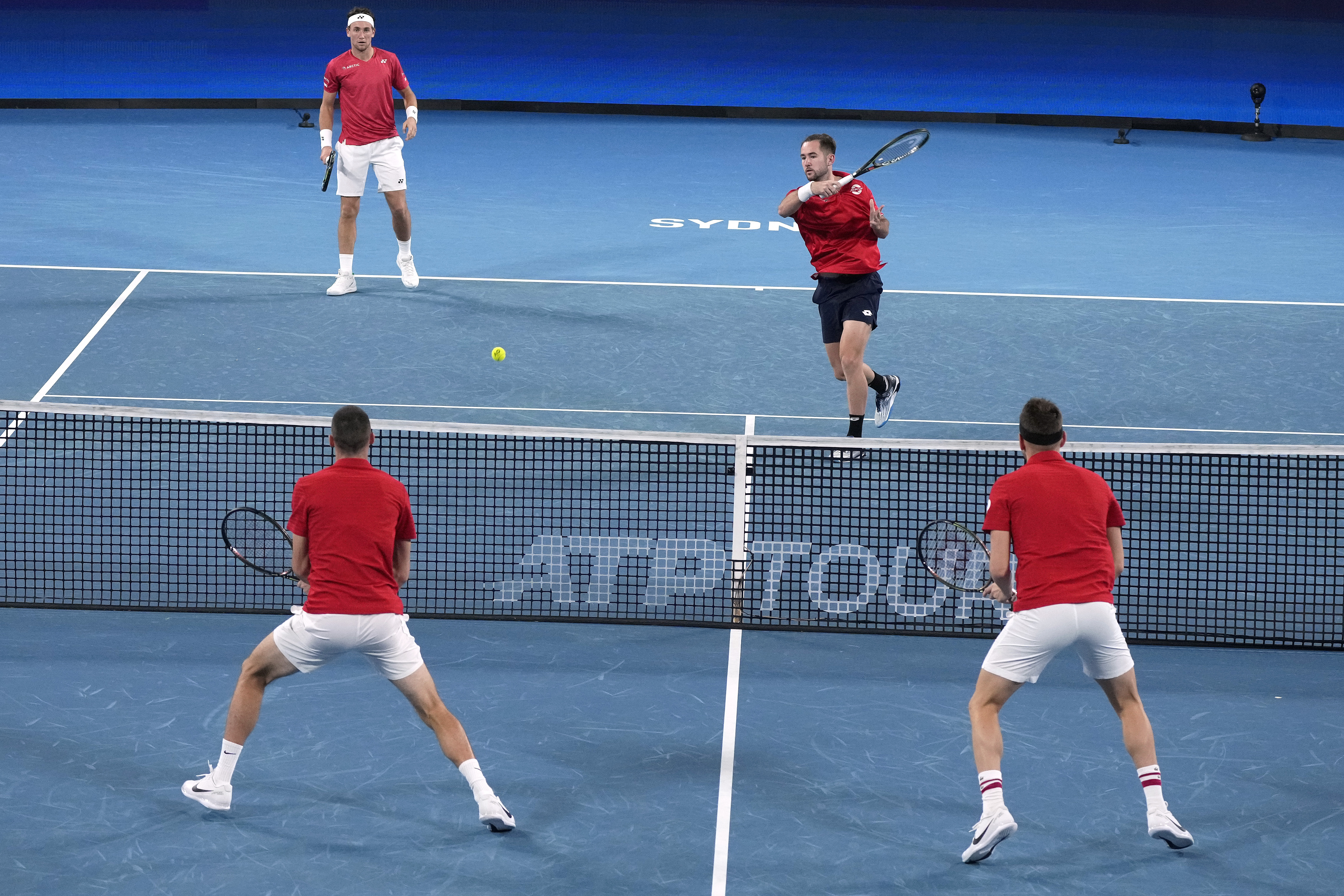 Serbia's Nikola Cacic, bottom left, and Filip Krajinovic, right, play against Norway's Casper Ruud and Viktor Durasovic, second right, in their doubles match at the ATP Cup tennis tournament in Sydney, Saturday, Jan. 1, 2022. (AP Photo/Rick Rycroft)