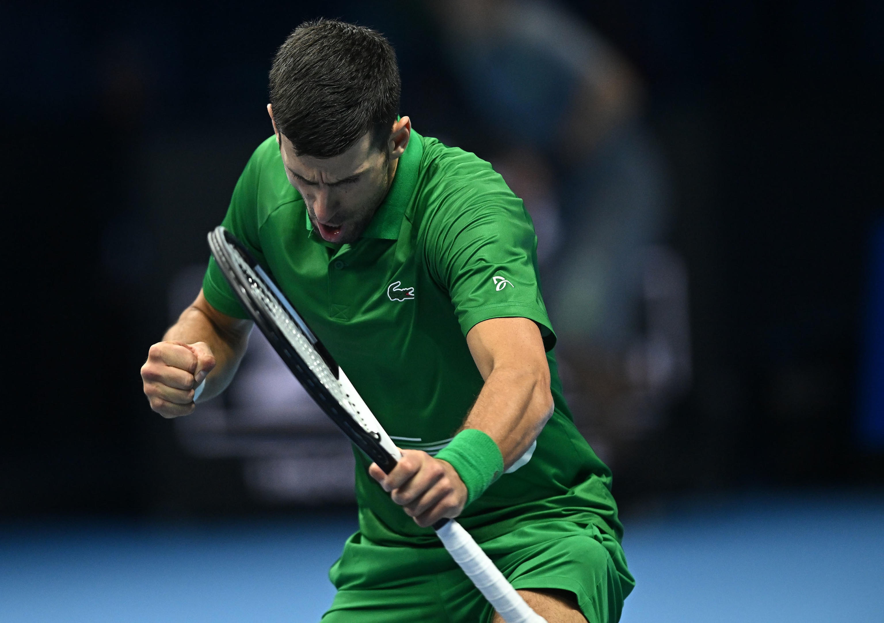 epa10306064 Novak Djokovic of Serbia celebrates after winning the match against Stefanos Tsitsipas of Greece at the Nitto ATP Finals 2022 tennis tournament at the Pala Alpitour arena in Turin, Italy, 14 November 2022.  EPA-EFE/ALESSANDRO DI MARCO