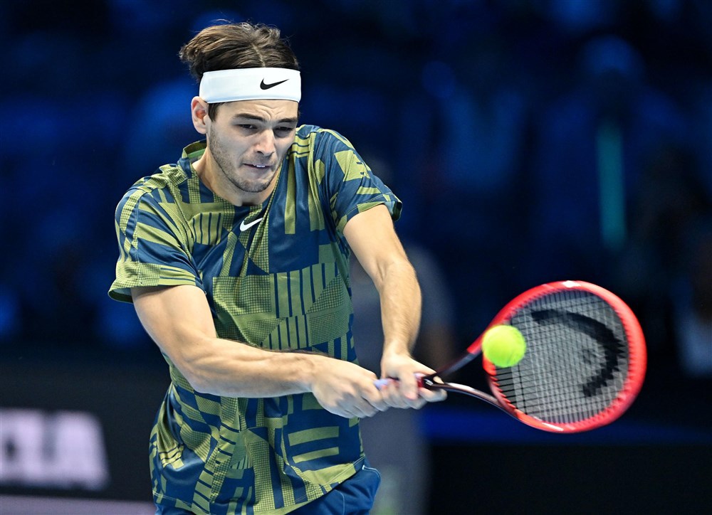 epa10311140 Taylor Fritz of the USA in action against Felix Auger-Aliassime of Canada during their singles match at the Nitto ATP Finals 2022 tennis tournament at the Pala Alpitour arena in Turin, Italy, 17 November 2022.  EPA-EFE/ALESSANDRO DI MARCO