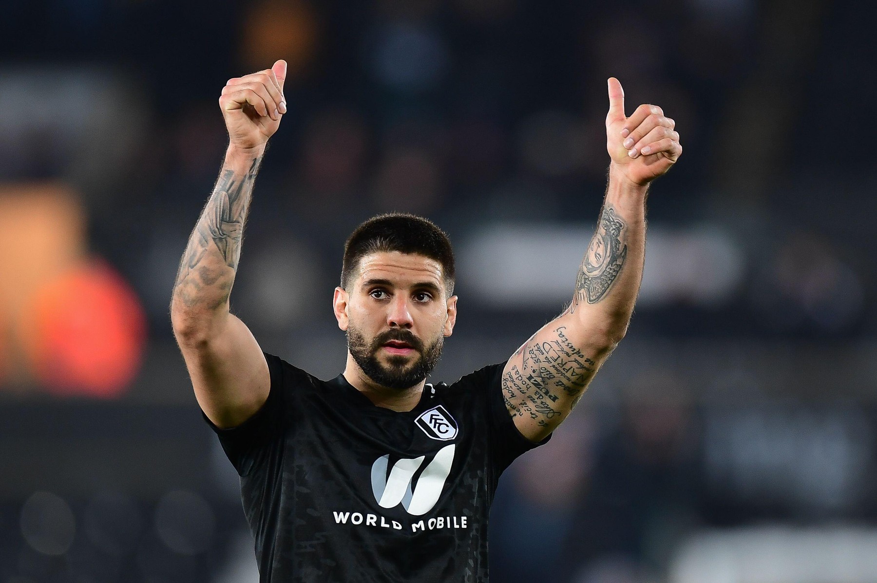 Aleksandar Mitrovic #9 of Fulham salutes the travelling supporters