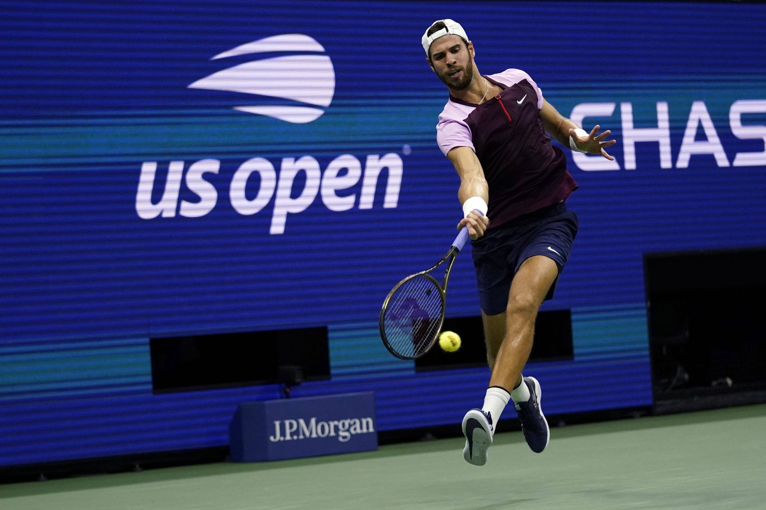 Karen Khachanov, of Russia, returns to Nick Kyrgios, of Australia, during the quarterfinals of the U.S. Open tennis championships, Tuesday, Sept. 6, 2022, in New York. (AP Photo/Charles Krupa)