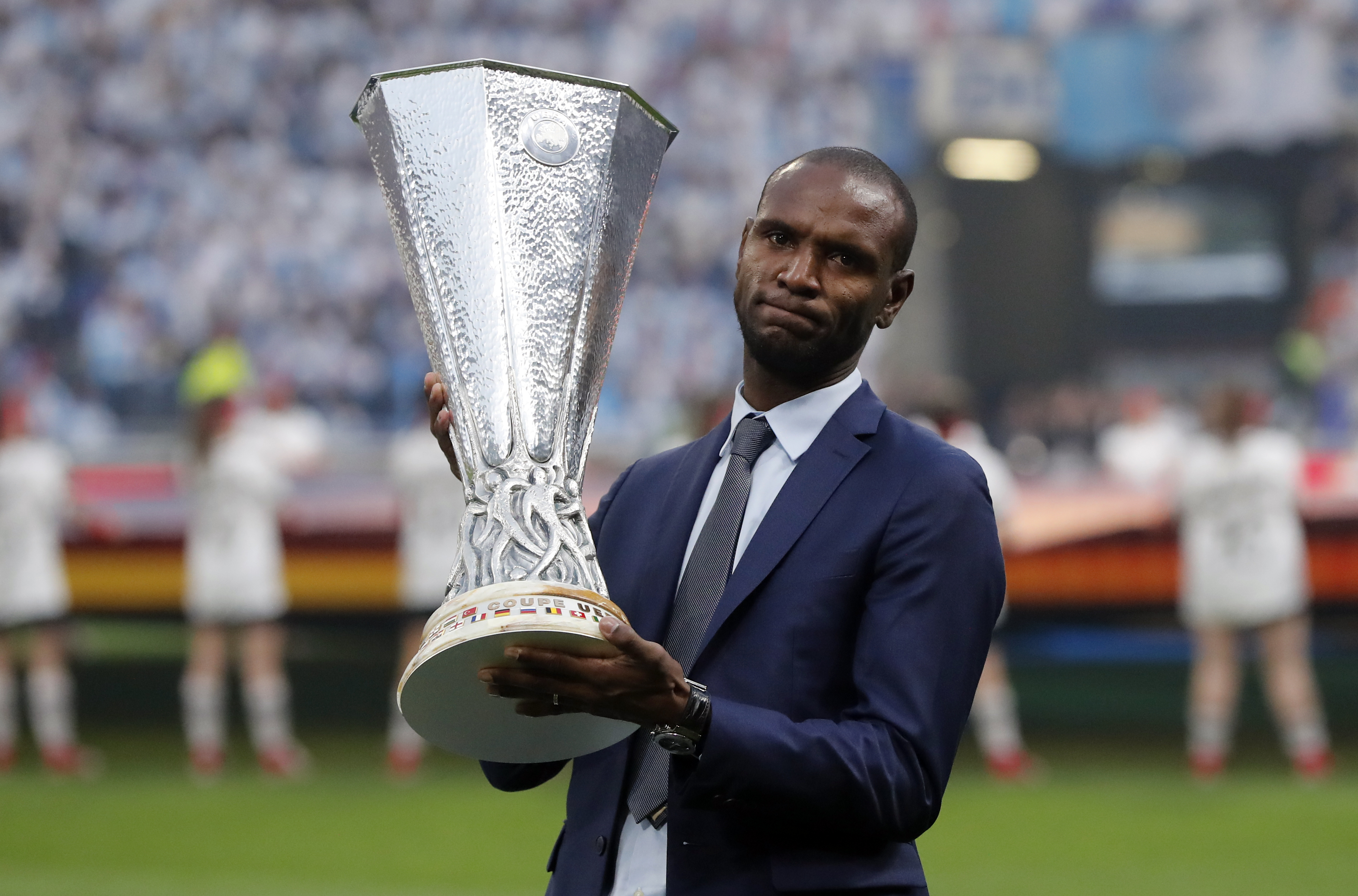 epa06742554 Former French soccer player Eric Abidal poses  with the Europa League trophy prior during the UEFA Europa League final between Olympique Marseille and Atletico Madrid in Lyon, France, 16 May 2018.  EPA-EFE/GUILLAUME HORCAJUELO