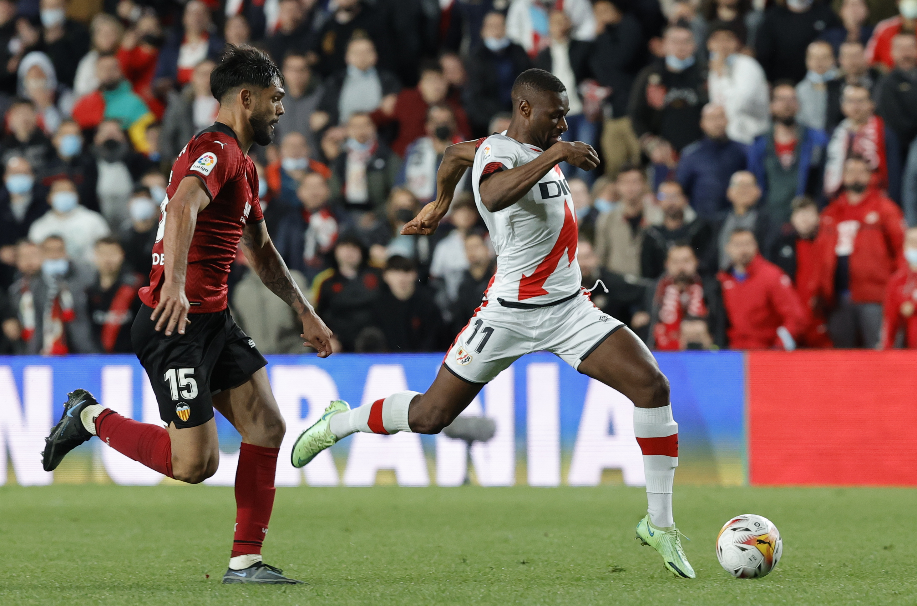 epa09885174 Rayo Vallecano's forward Mamadou Sylla (R) in action against Valencia's Omar Alderete (L) during a Spanish LaLiga soccer match between Rayo Vallecano and Valencia CF at Vallecas stadium in Madrid, Spain, 11 April 2022.  EPA-EFE/ZIPI