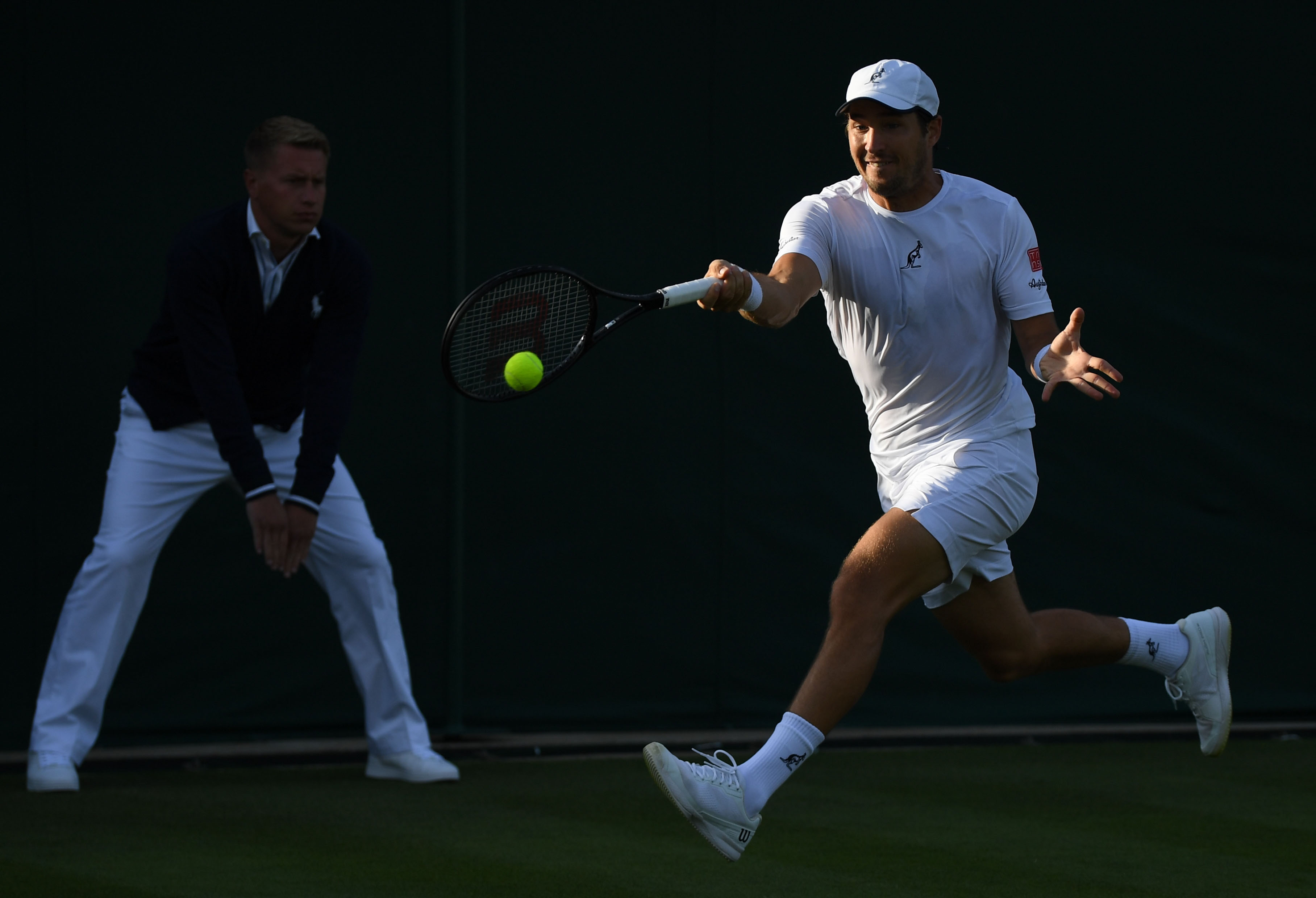 epa10037358 Dusan Lajovic of Serbia in action in the men's first round match against Pablo Carreno Busta of Spain at the Wimbledon Championships, in Wimbledon, Britain, 27 June 2022.  EPA-EFE/NEIL HALL   EDITORIAL USE ONLY