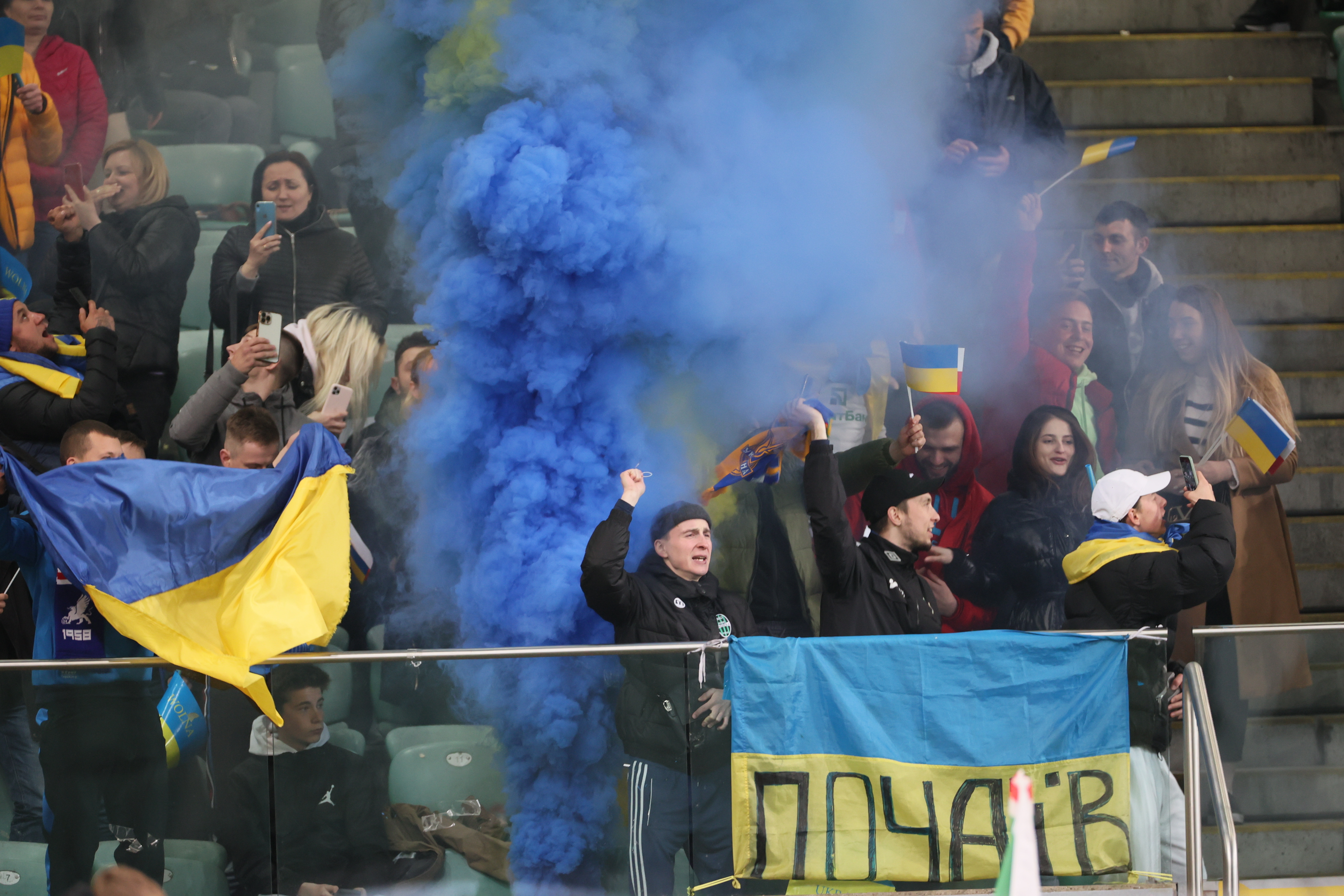 epa09886960 Ukrainian fans during a charity match between Legia Warsaw and FC Dynamo Kyiv, Poland, April 12, 2022. The charity match was played as part of the European series "Match for Peace!"  EPA-EFE/Leszek Szymanski POLAND OUT