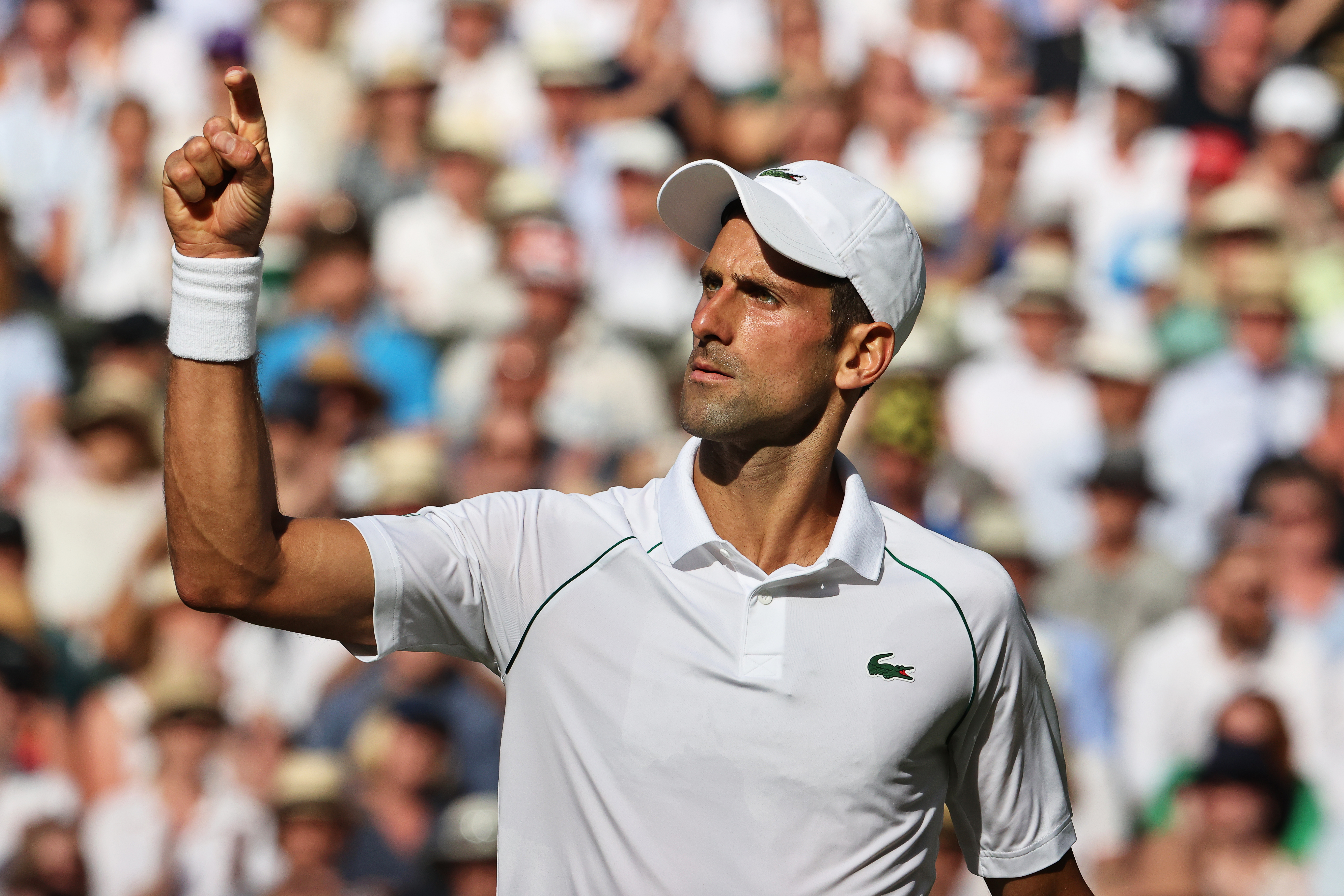 epa10059828 Novak Djokovic of Serbia reacts during his men's semi final match against Cameron Norrie of Britain at the Wimbledon Championships in Wimbledon, Britain, 08 July 2022.  EPA-EFE/KIERAN GALVIN   EDITORIAL USE ONLY