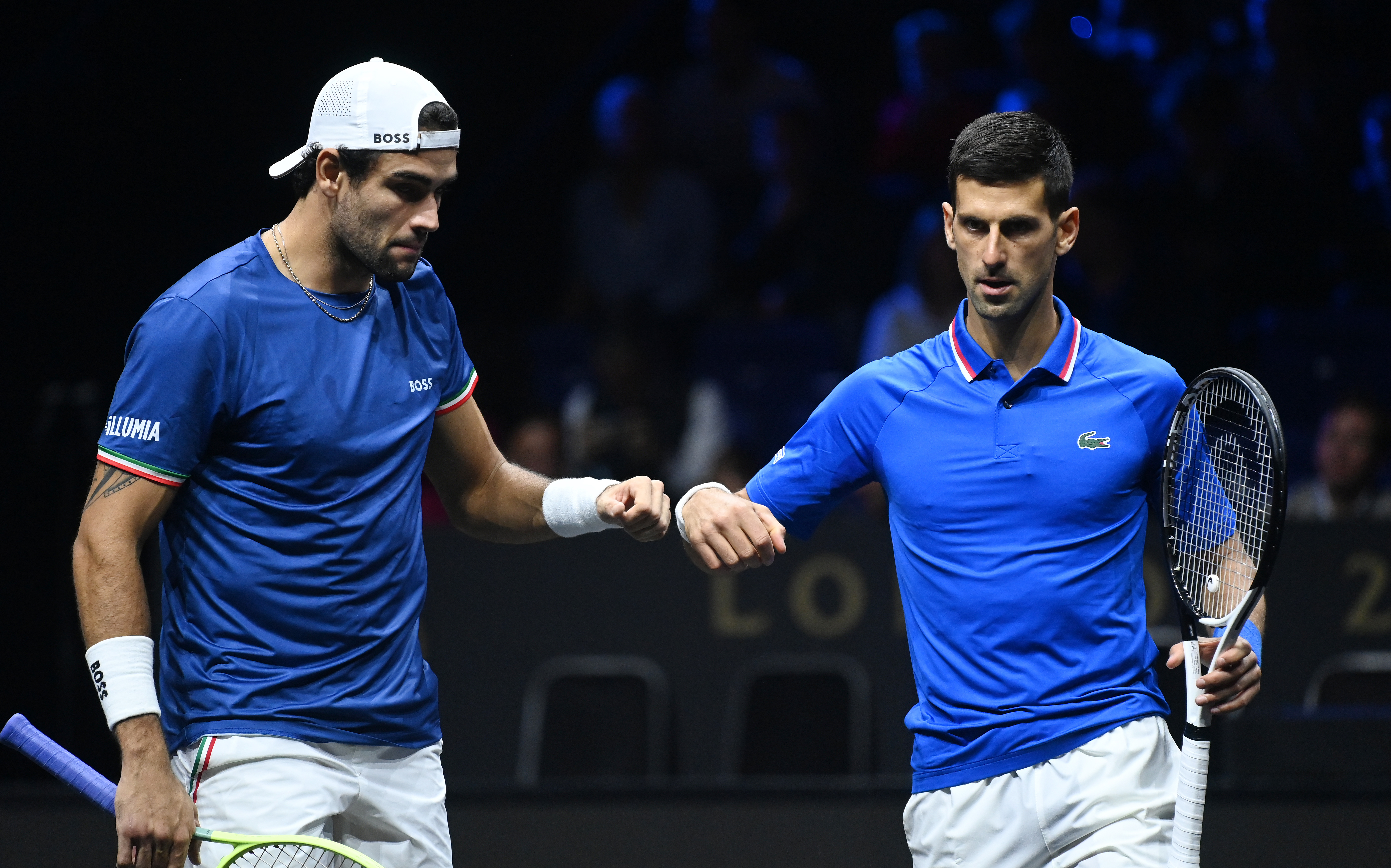 epa10204453 Novak Djokovic of Team Europe (R) with term mate Matteo Berrettini (L) during their Laver Cup doubles match against Alex De Minaur and Jack Sock of Team World at the O2 Arena in London, Britain, 24 September 2022.  EPA-EFE/ANDY RAIN