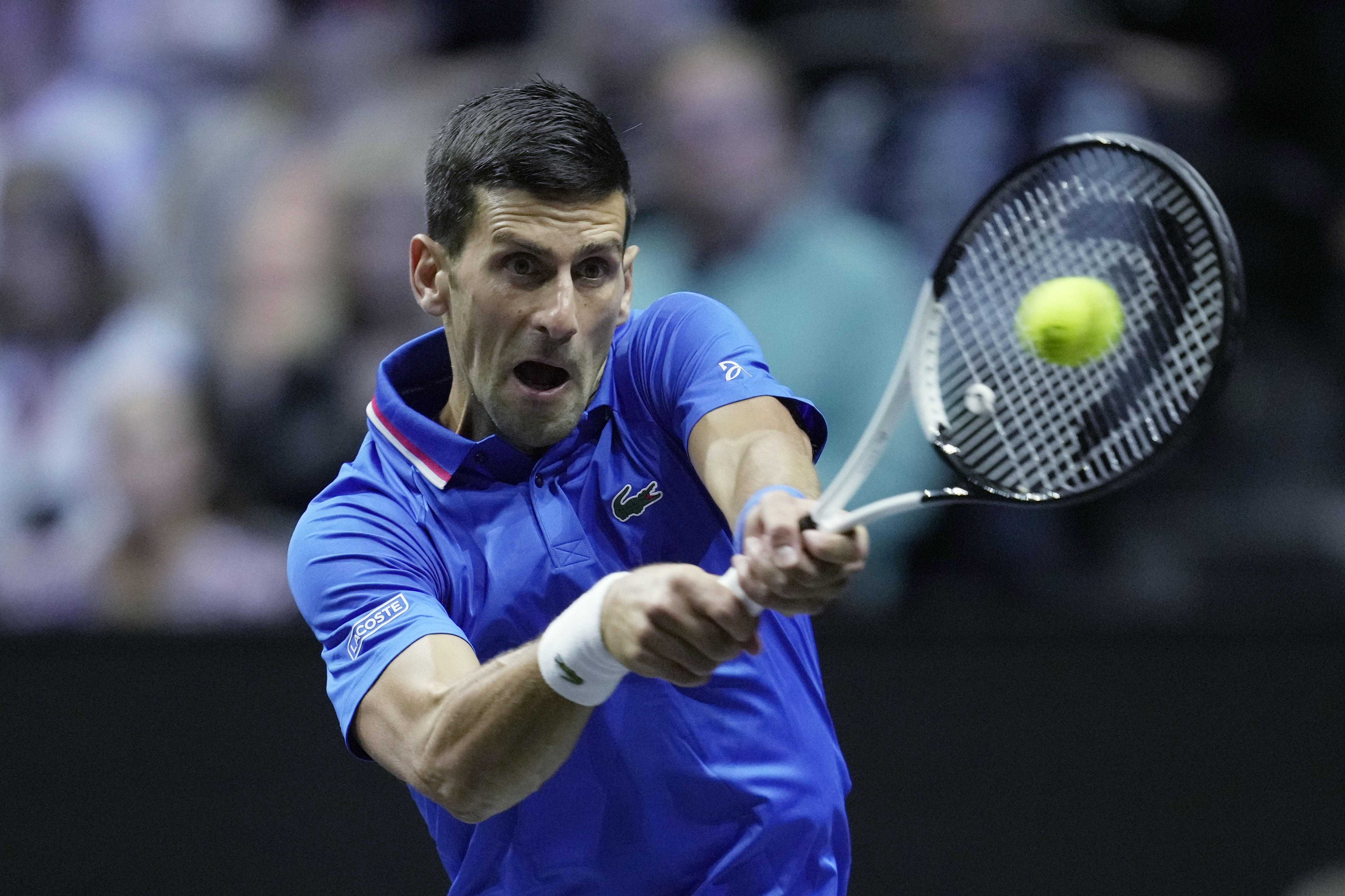 Team Europe's Novak Djokovic, returns a ball to Team World's Frances Tiafoe during a match on second day of the Laver Cup tennis tournament at the O2 in London, Saturday, Sept. 24, 2022. (AP Photo/Kin Cheung)