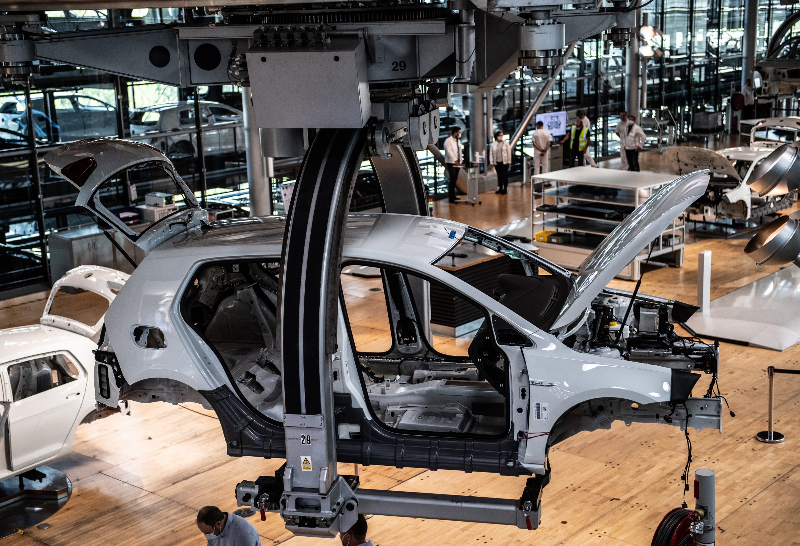 epa08690670 A view of the production line of the  Volkswagen e-Golf car at the Volkswagen Glaeserne Manufaktur (Transparent Factory) in Dresden, Germany, 23 September 2020.  EPA-EFE/FILIP SINGER