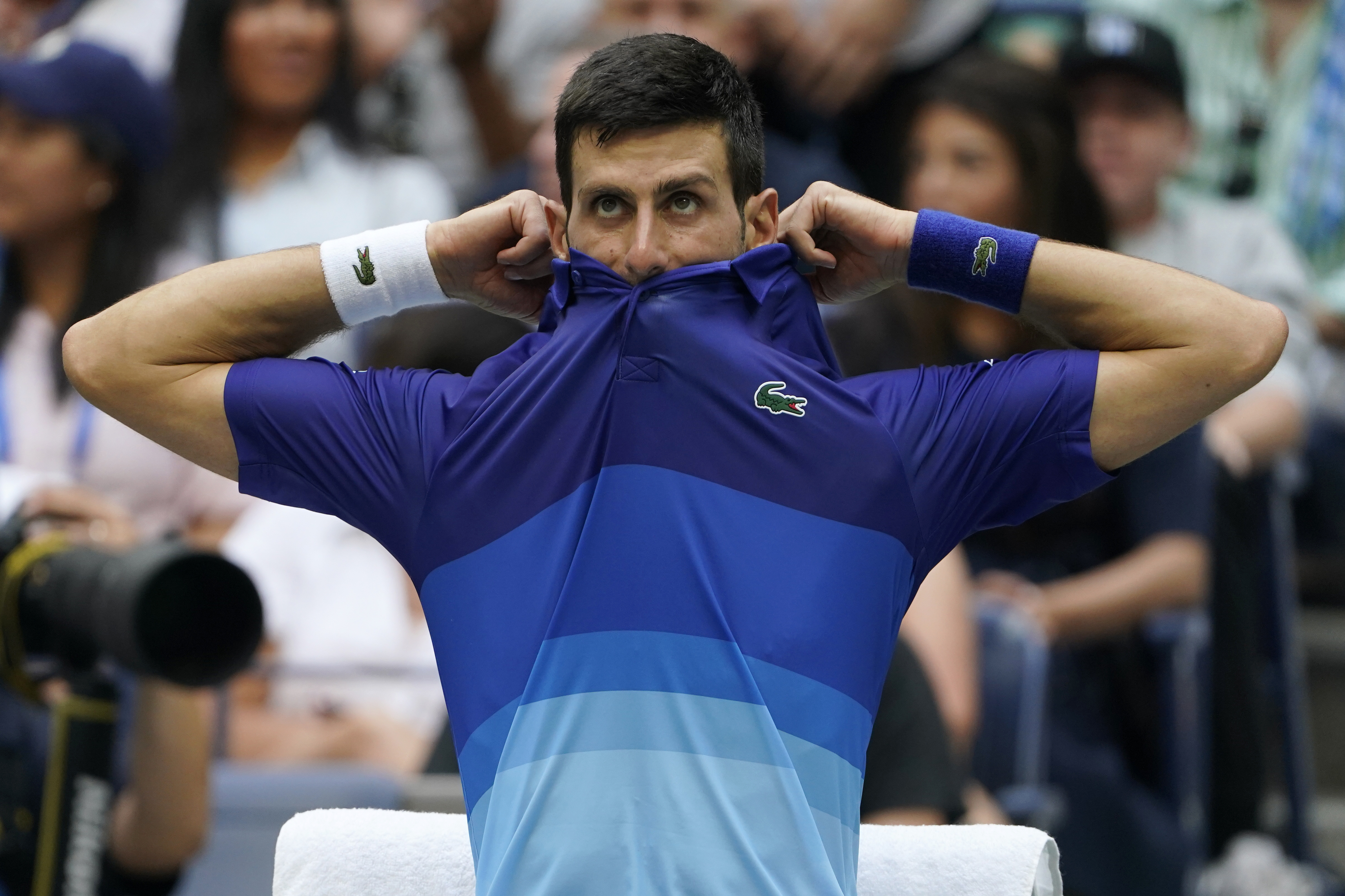 Novak Djokovic, of Serbia, adjusts his shirt between games against Daniil Medvedev, of Russia, during the men's singles final of the US Open tennis championships, Sunday, Sept. 12, 2021, in New York. (AP Photo/John Minchillo)