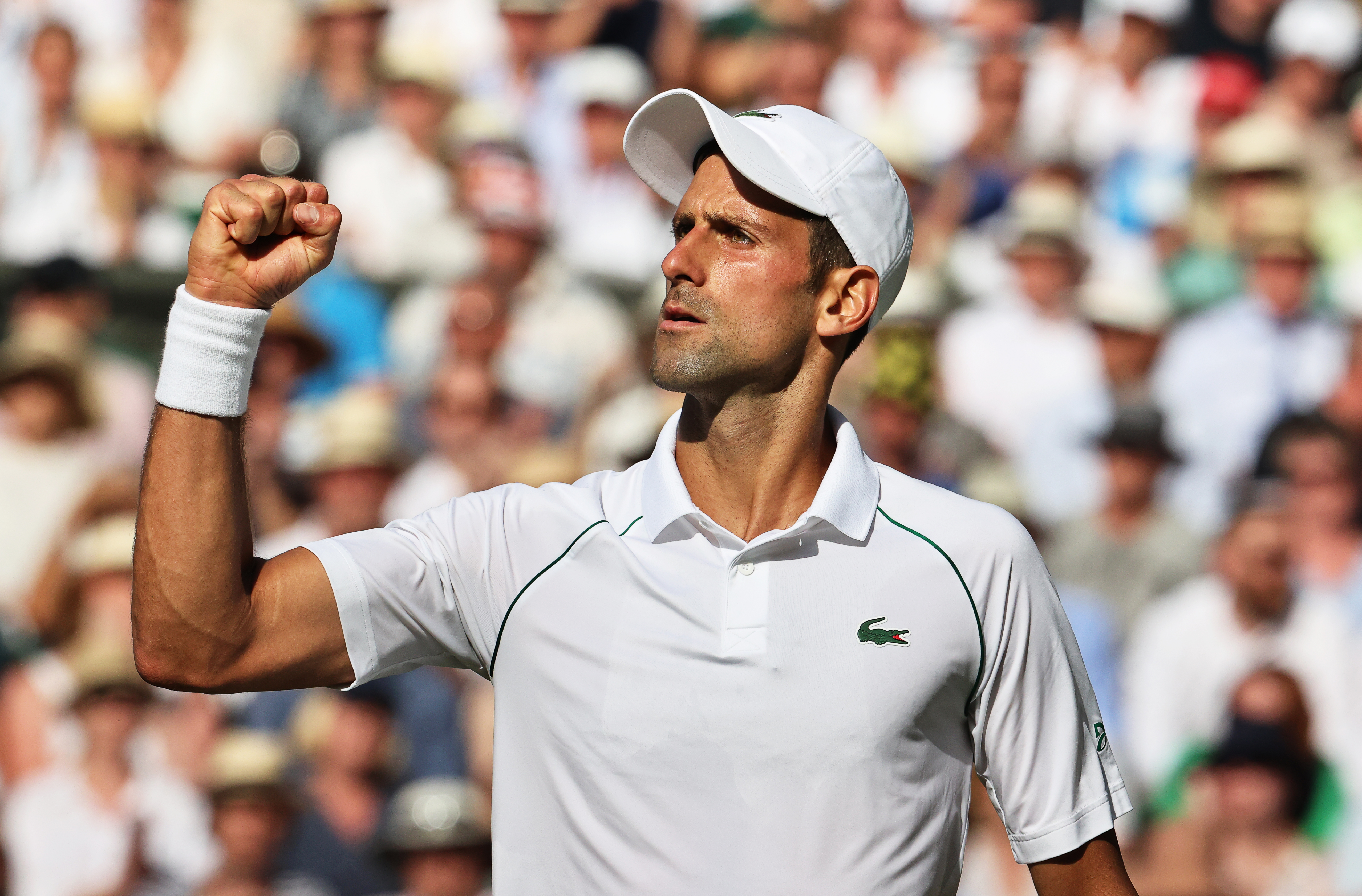epa10059838 Novak Djokovic of Serbia reacts during his men's semi final match against Cameron Norrie of Britain at the Wimbledon Championships in Wimbledon, Britain, 08 July 2022.  EPA-EFE/KIERAN GALVIN   EDITORIAL USE ONLY